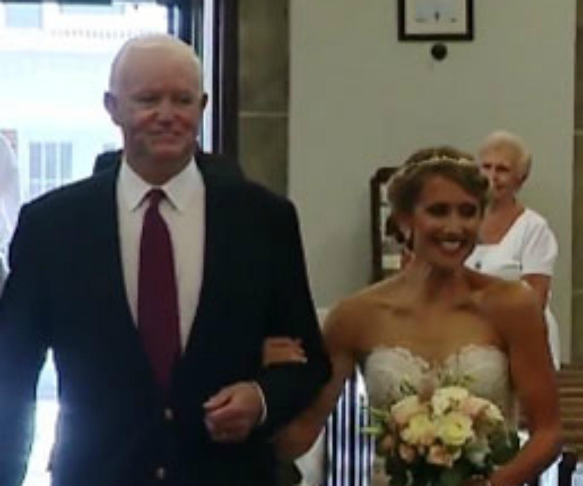 Bride gets walked down the aisle by man who received her dad’s heart