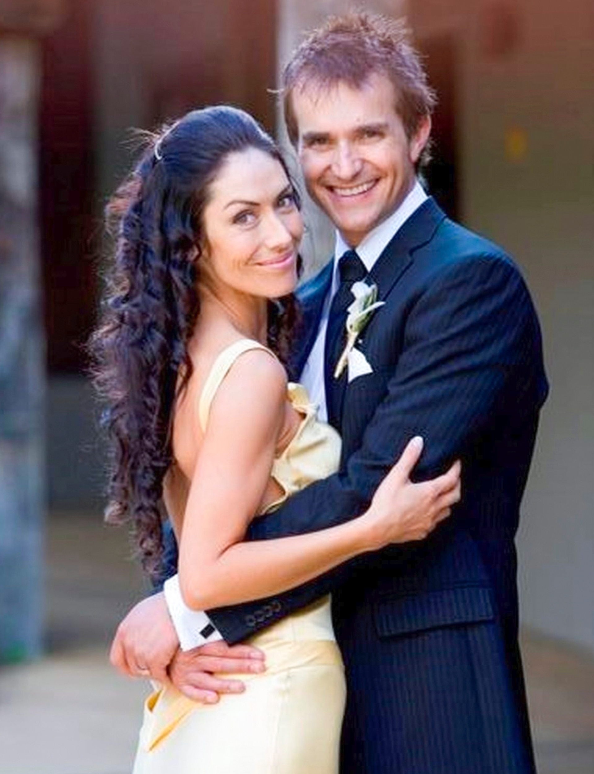 John Aiken hugging wife Kelly on the day they confirmed their marriage