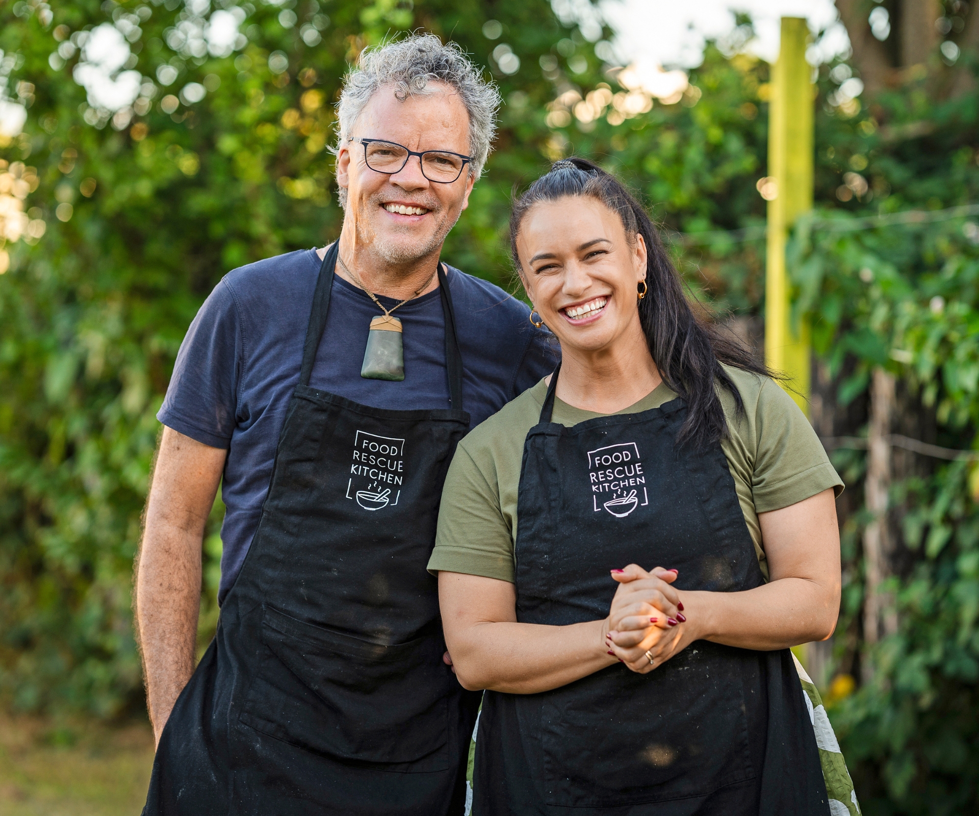 Peter Gordon and Naomi Toilalo in black aprons after cooking with food scraps