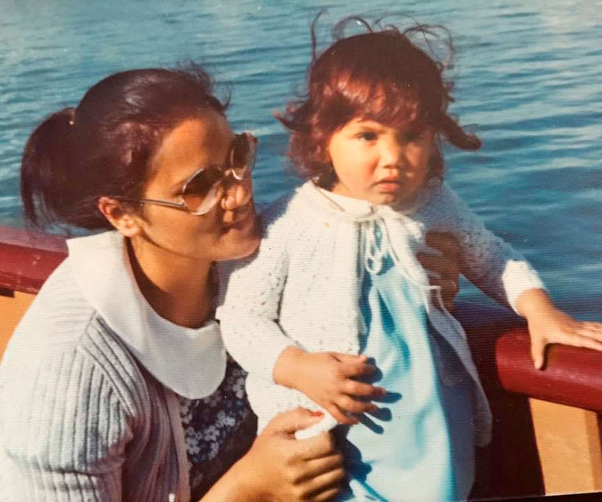 An old image of Kiri when she was a toddler with her mother on a boat