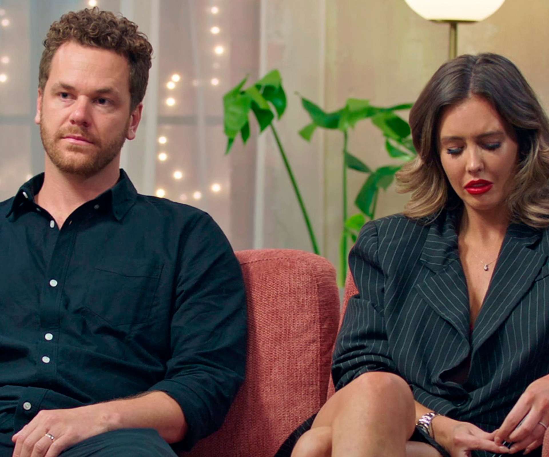 Jesse sitting next to a visibly upset CJ on the MAFS couches