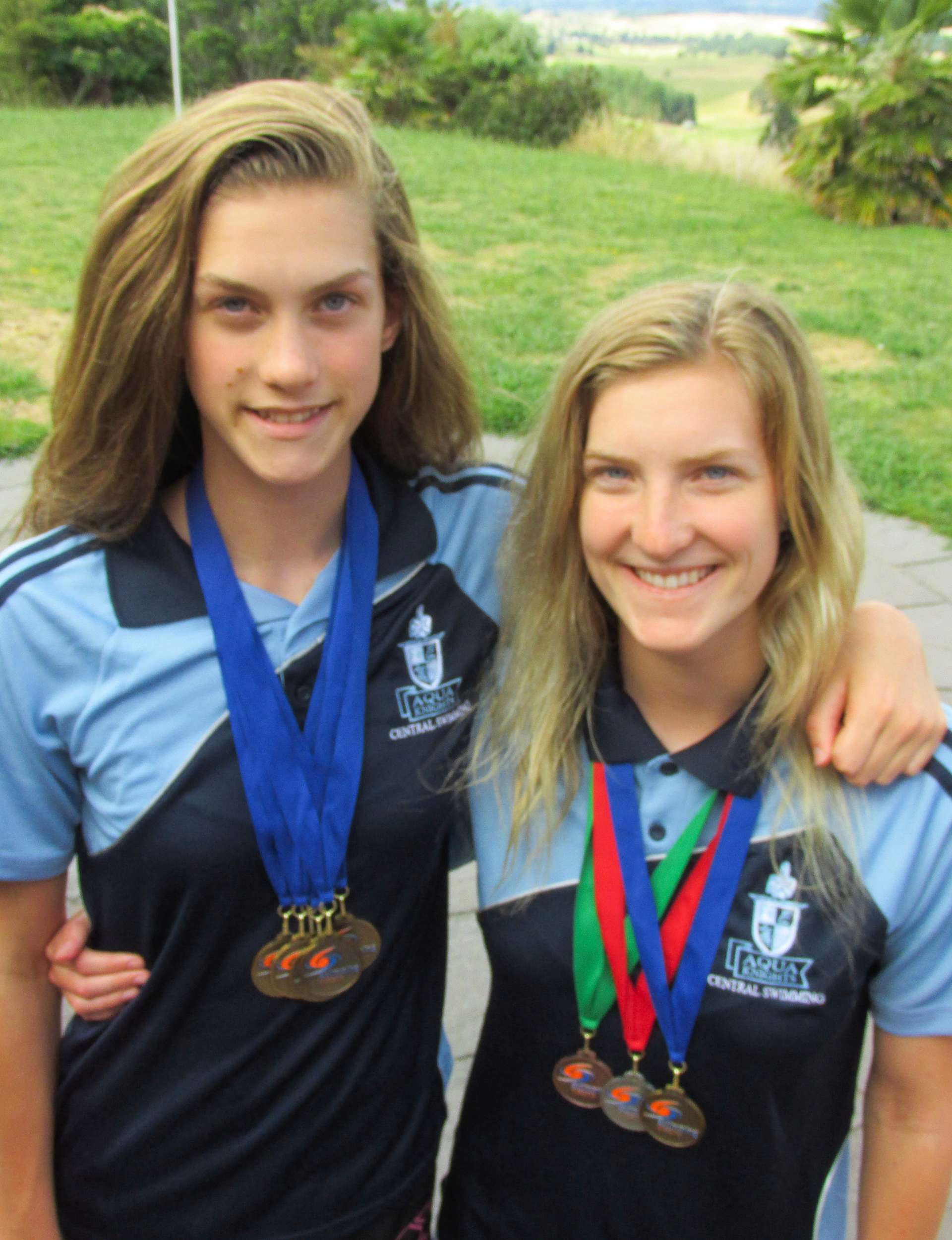 Hazel with four and sister Chelsea with three medals around their necks when they were younger