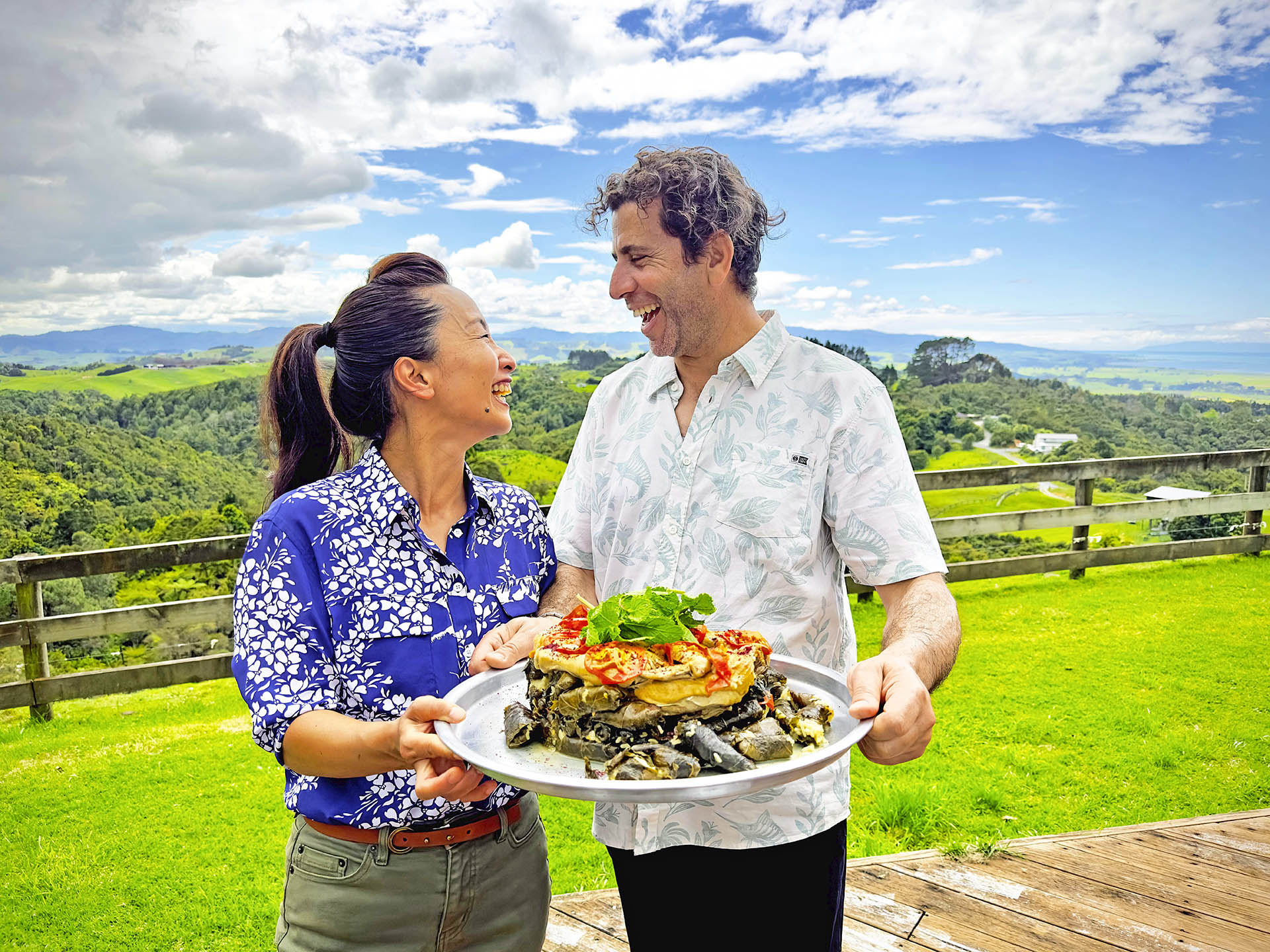 Sachie Nomura and Ibrahem Break, Waitoa chicken farmer, holding a Waraq Enab dish