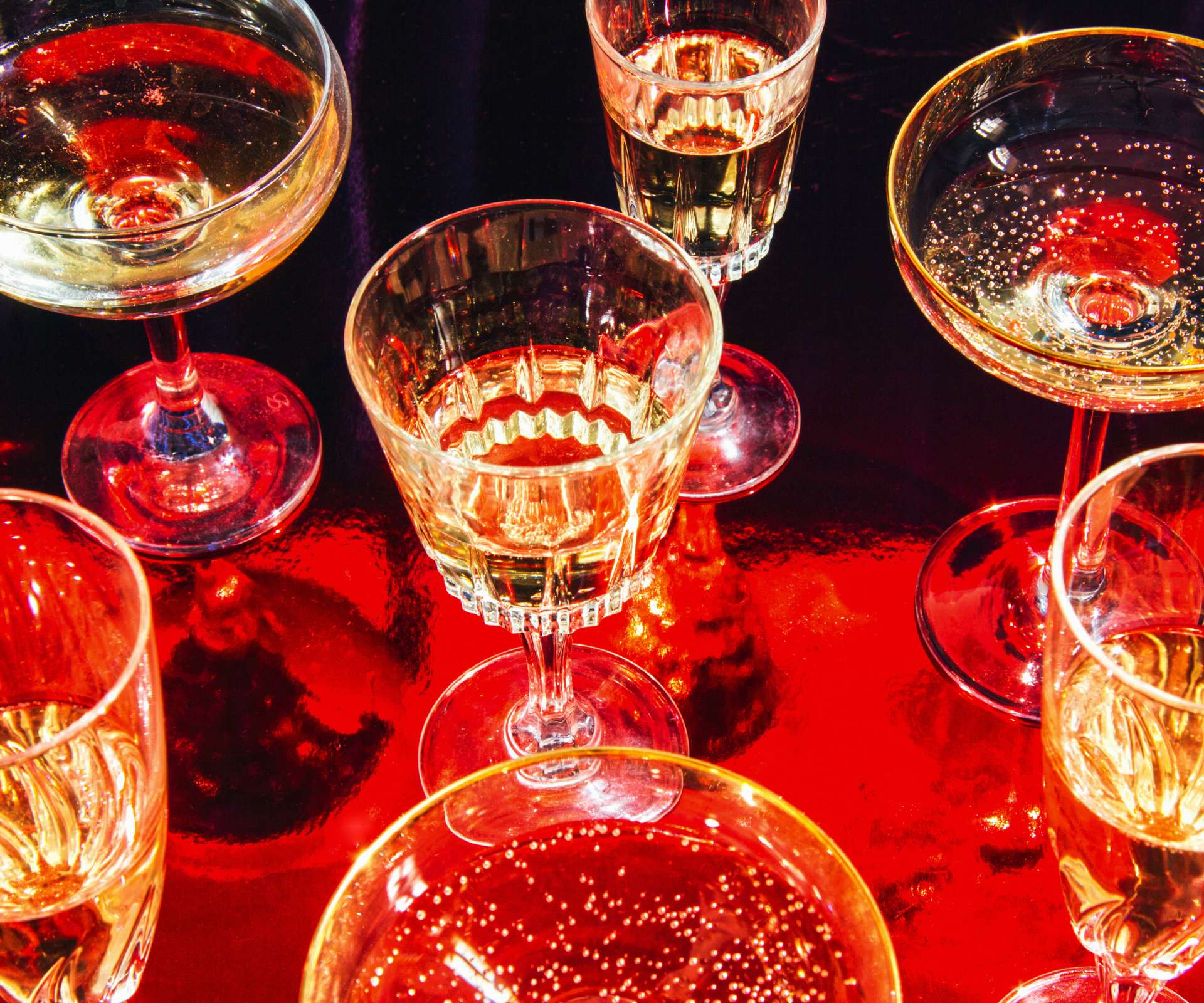 wine and cocktail glasses on a bar