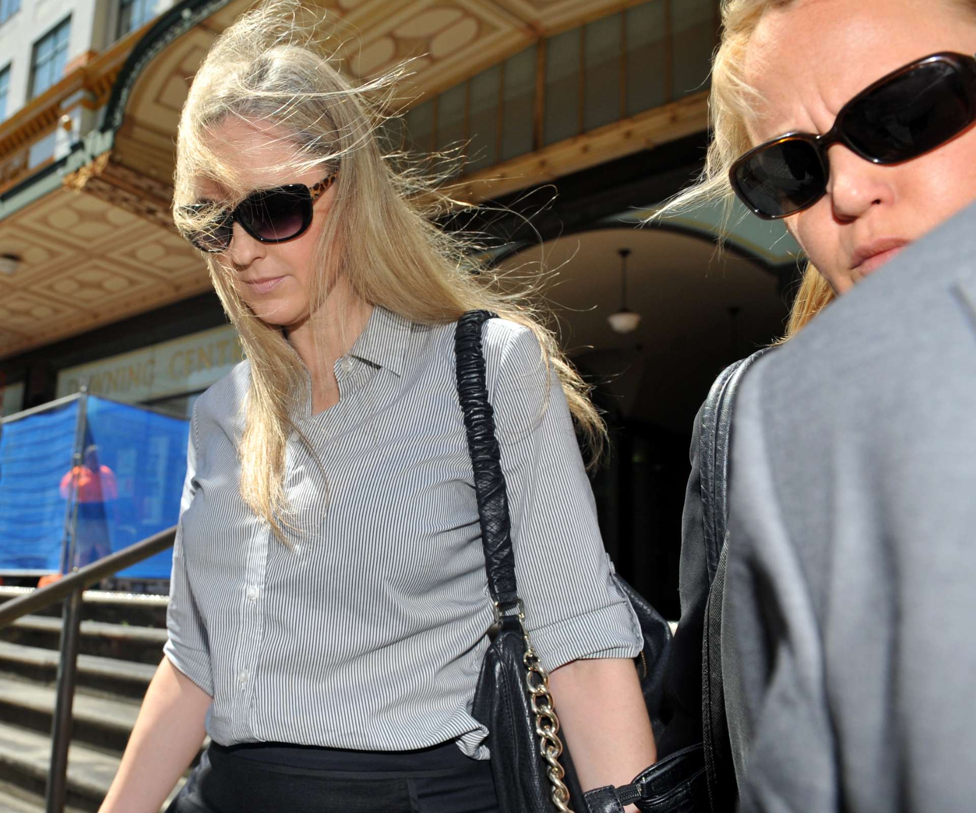 A woman walking out of a building