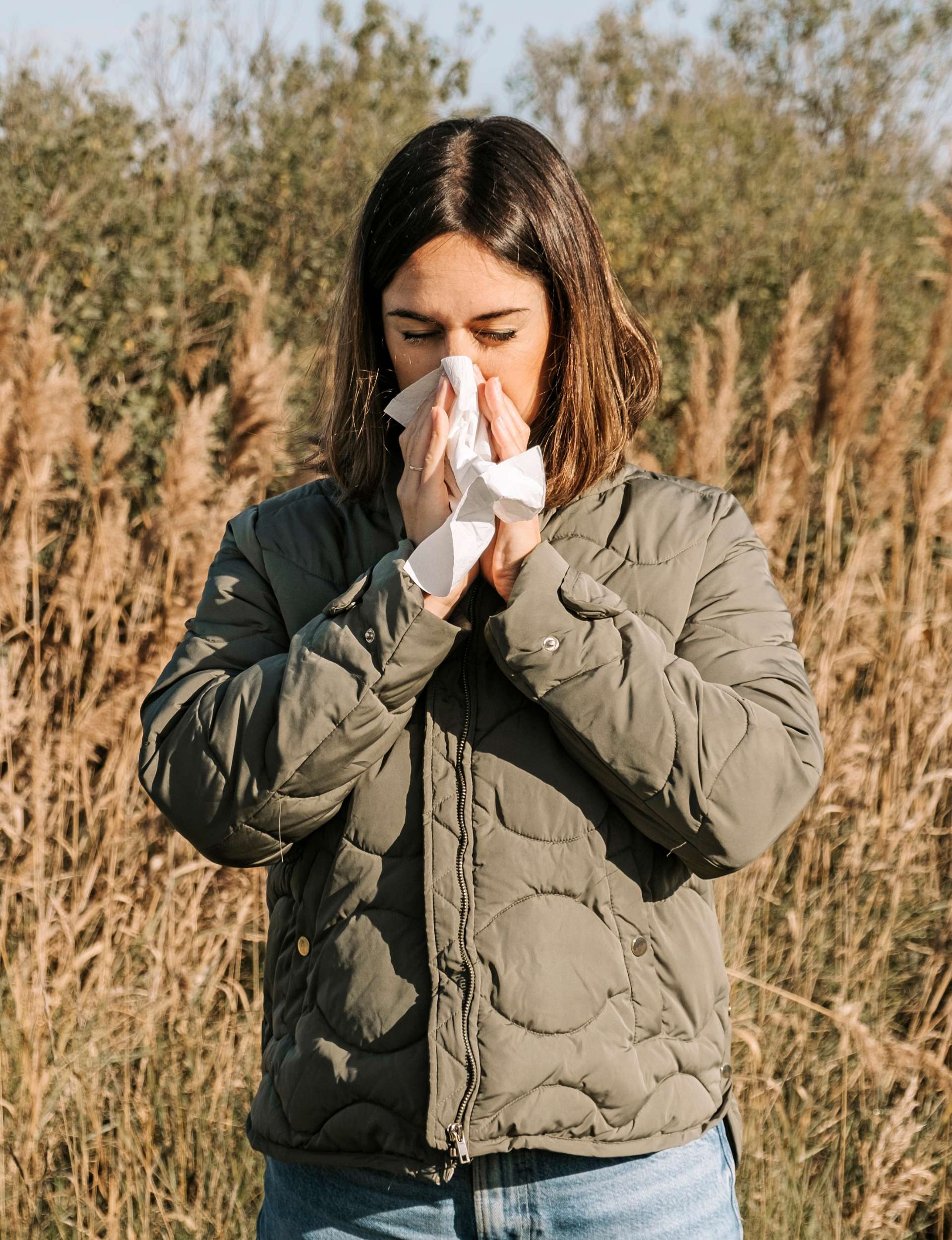 Woman blowing her nose