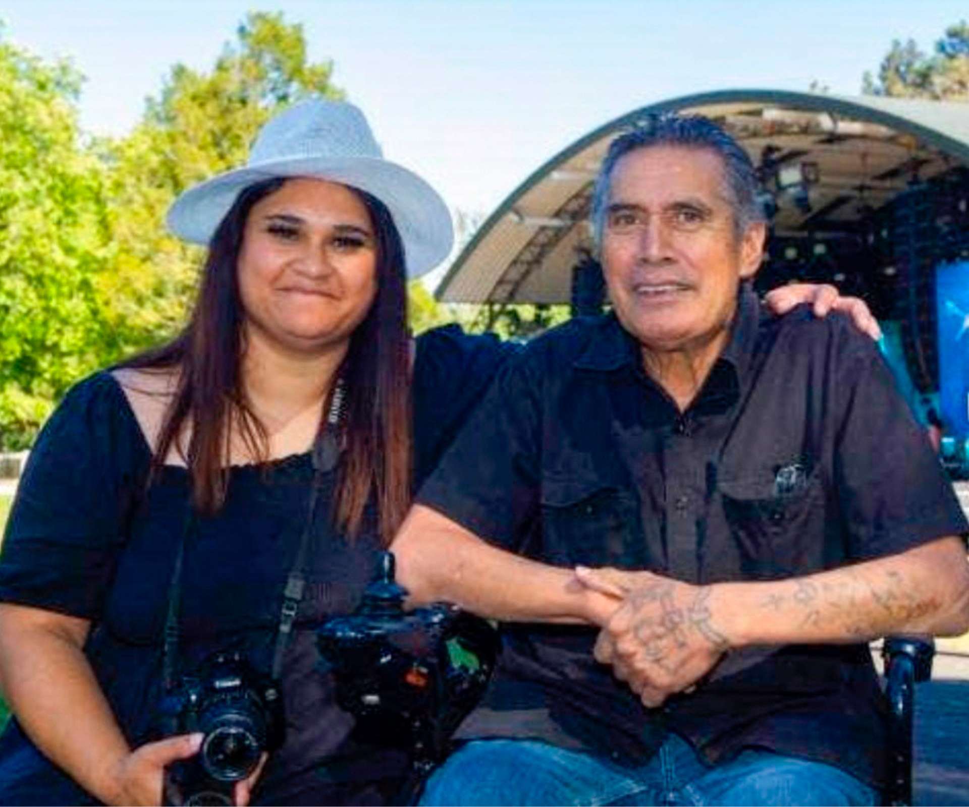 Ashleigh and dad Ashley sitting together at a concert