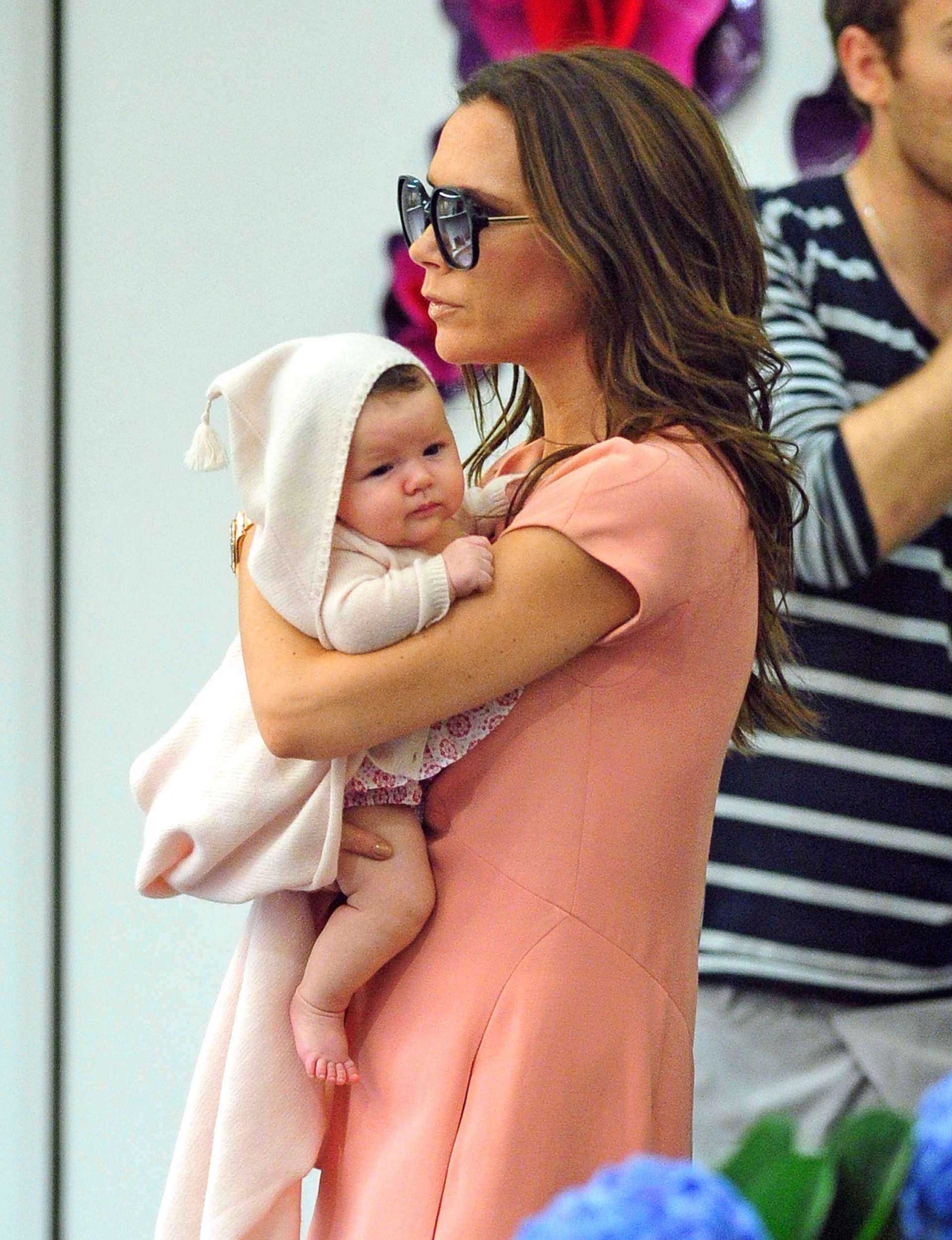 Victoria Beckham holding baby Harper