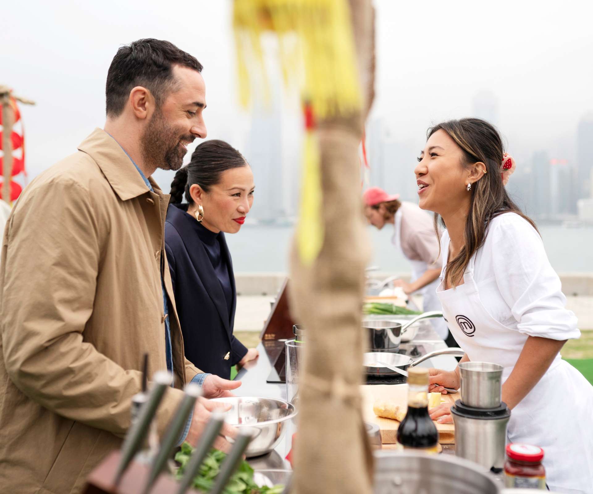 Mimi chatting tot he MasterChef judges over her workbench