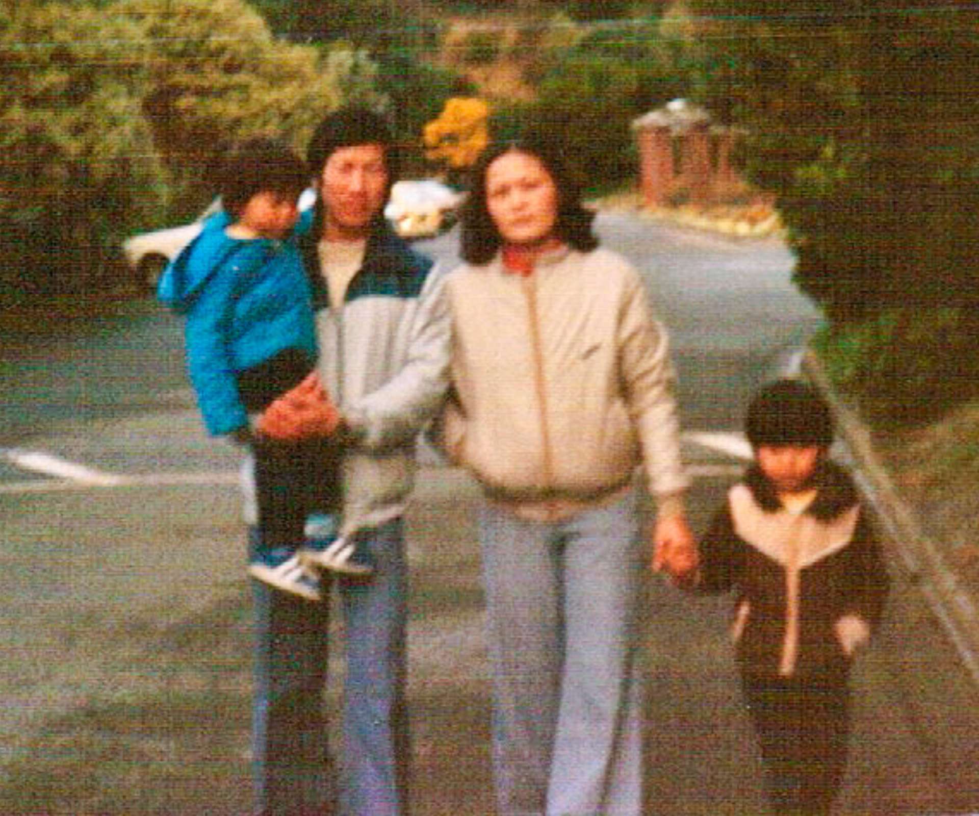 Bayley with his parents and brother when he was young