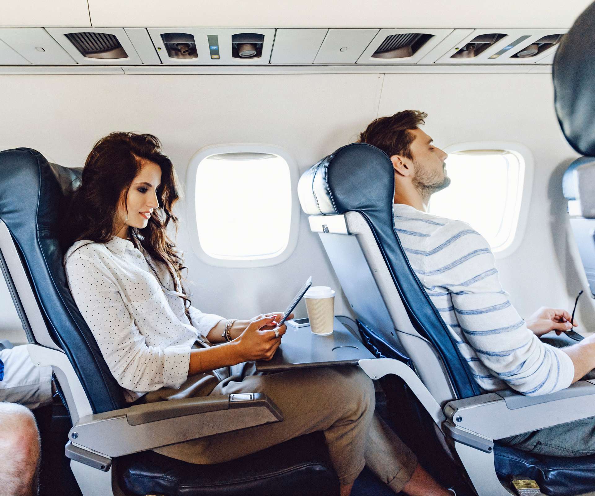 Two people flying economy