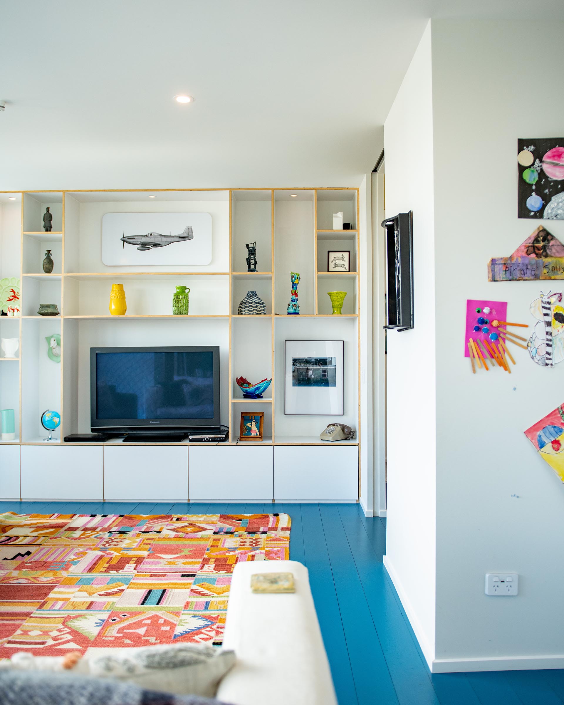 The living room of the 2024 Resene Colour Home Award winning home with the floorboards painted in Resene Spinnaker