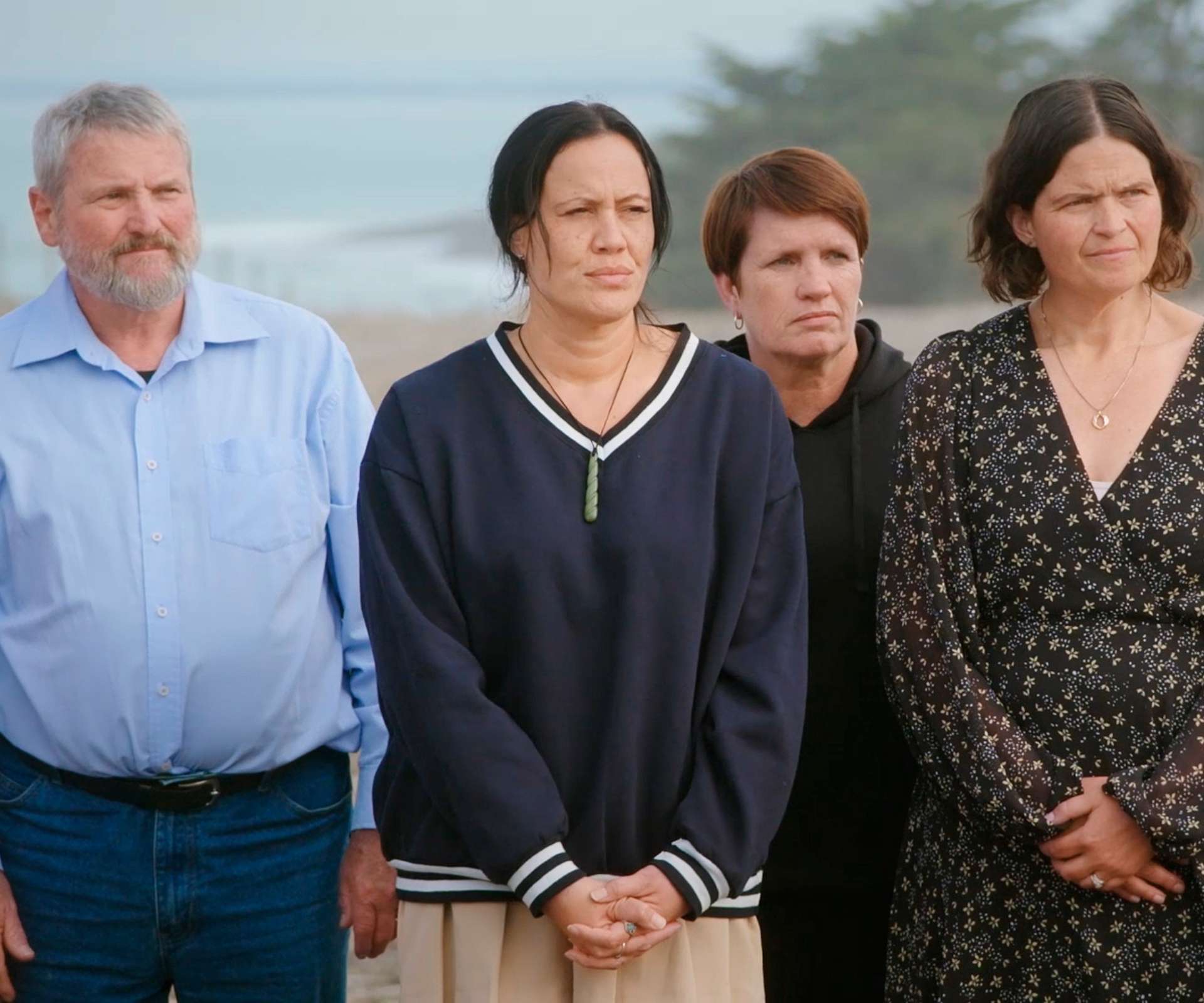 Jane with traitors co-stars standing on a beach
