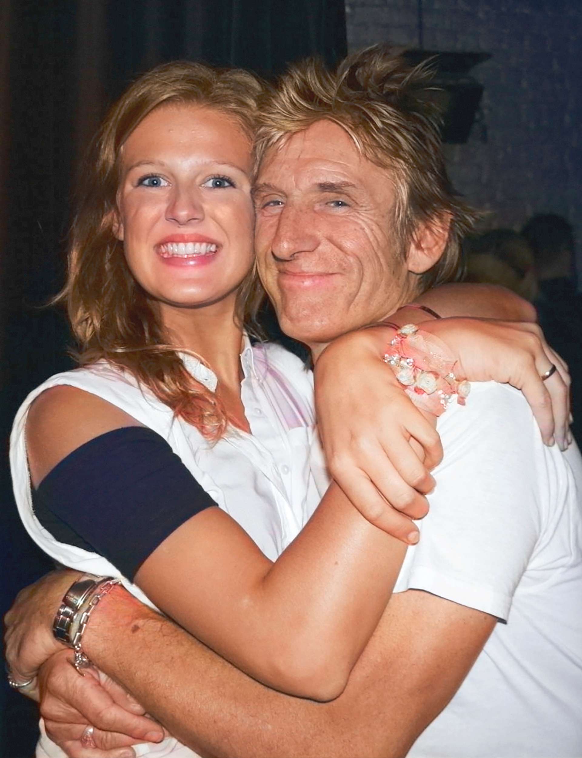 Moana and Dave McArtney hugging, Moana's grin bigger then ever