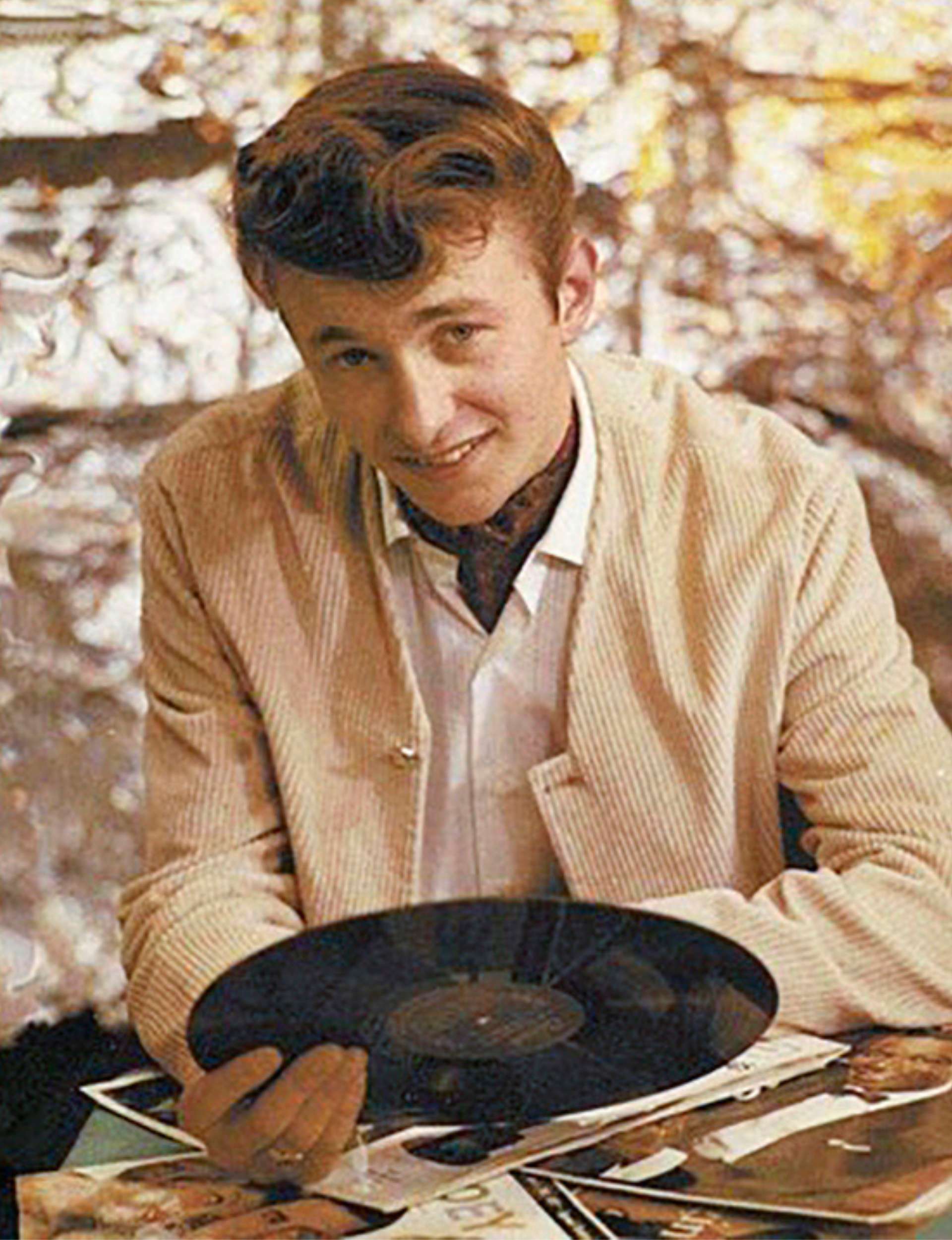 Ray Woolf holding a record in the '60s