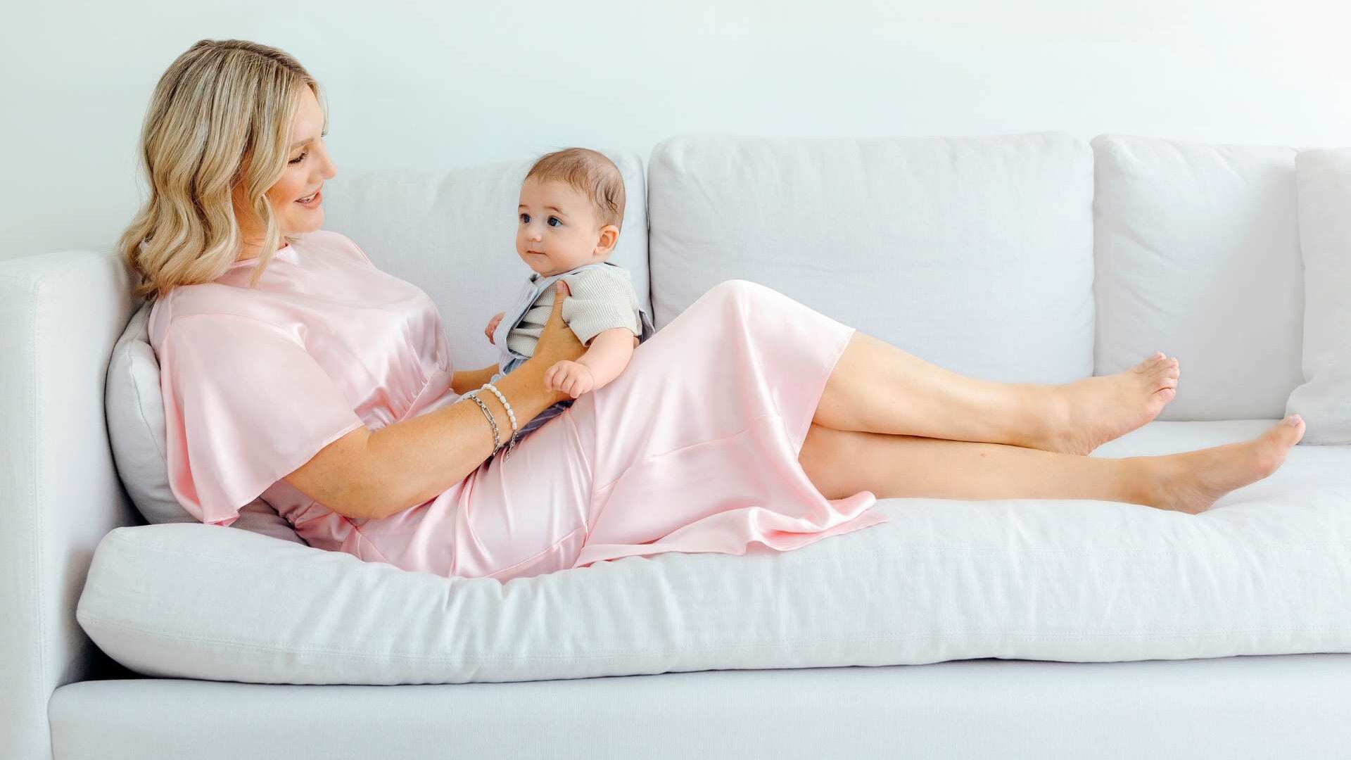 Hayley sitting on the couch with Kingston on her lap