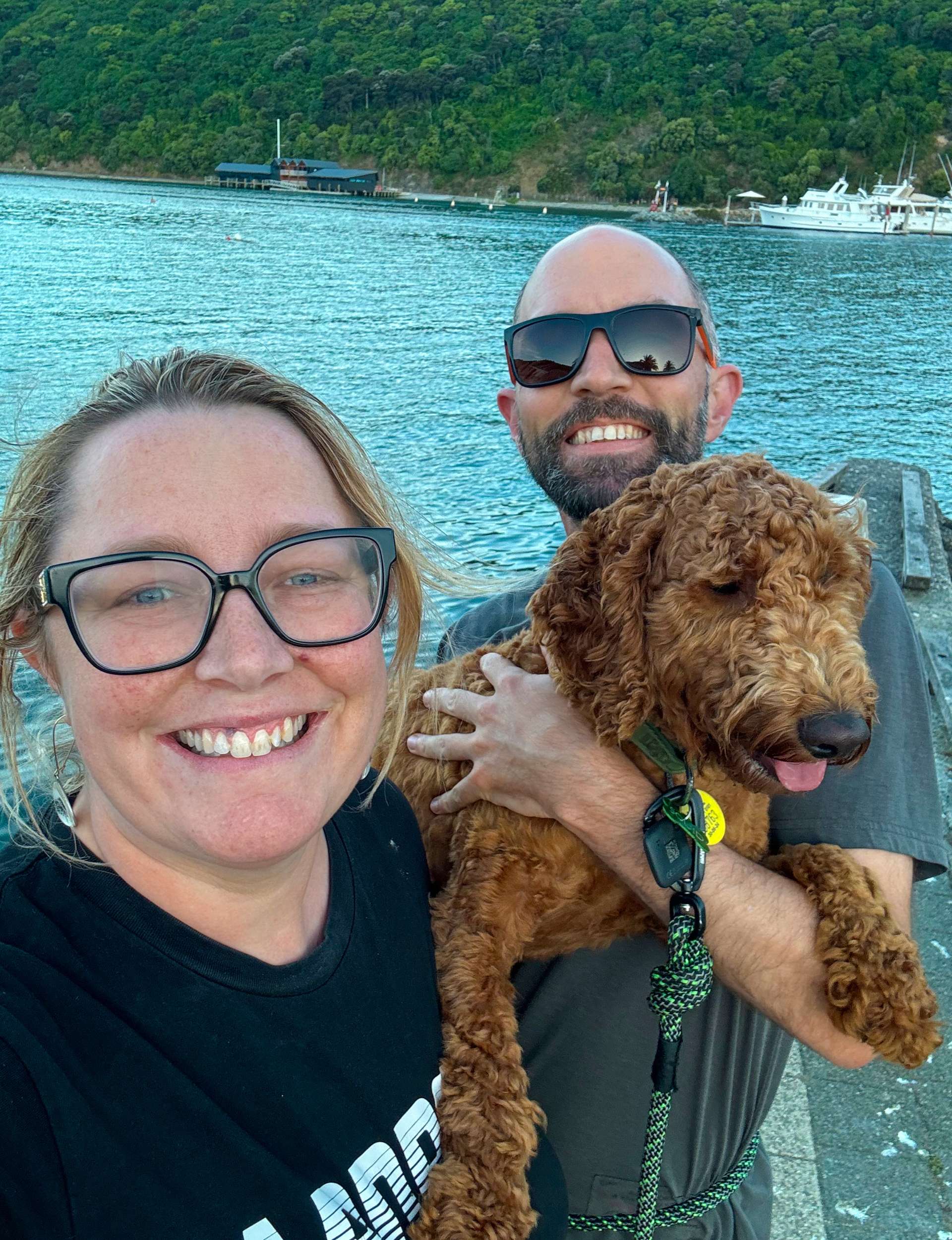 A selfie with her partner and their pup