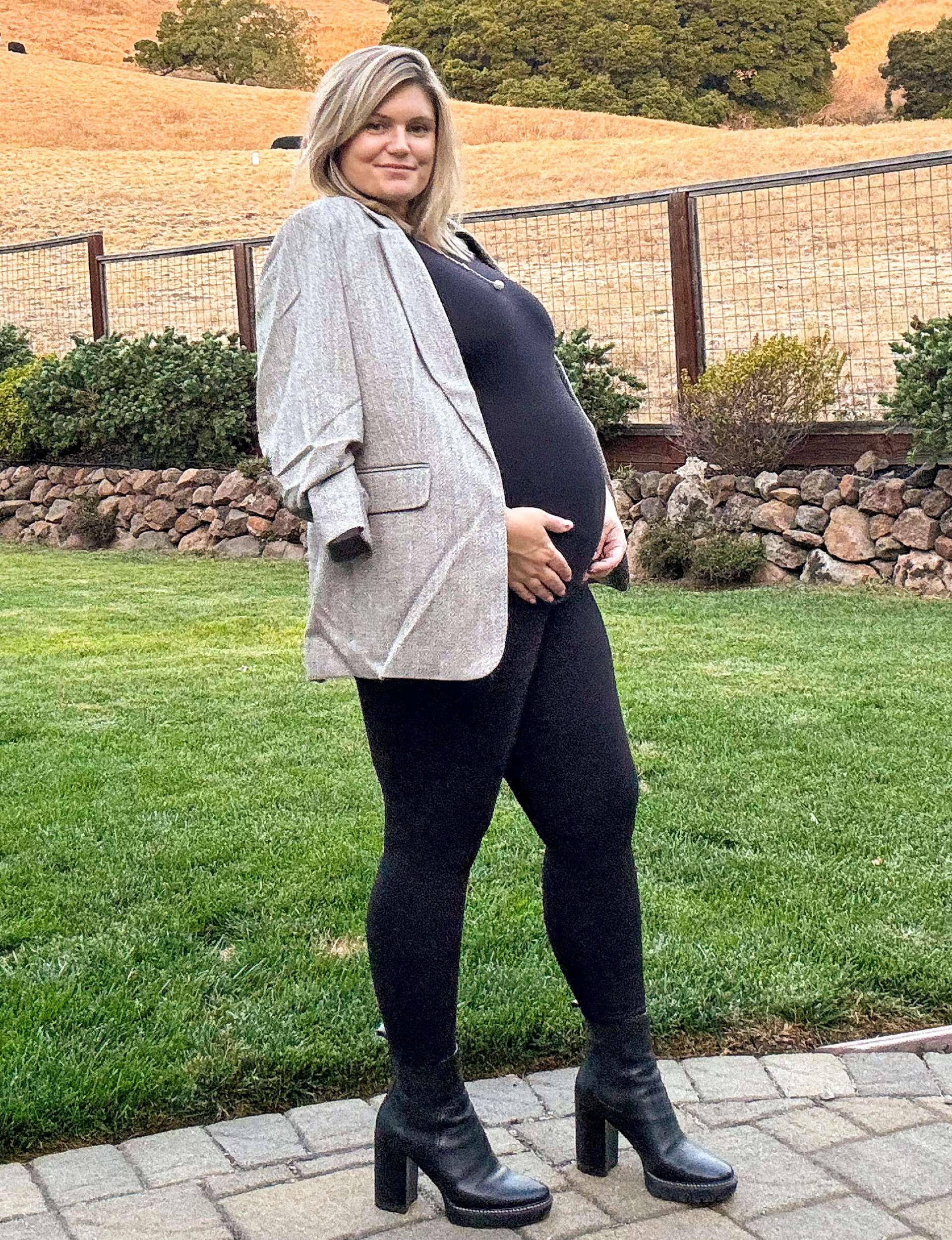 Maddy showing off her pregnant belly during her brother Travis and his Kiwi partner Emma's surrogacy journey