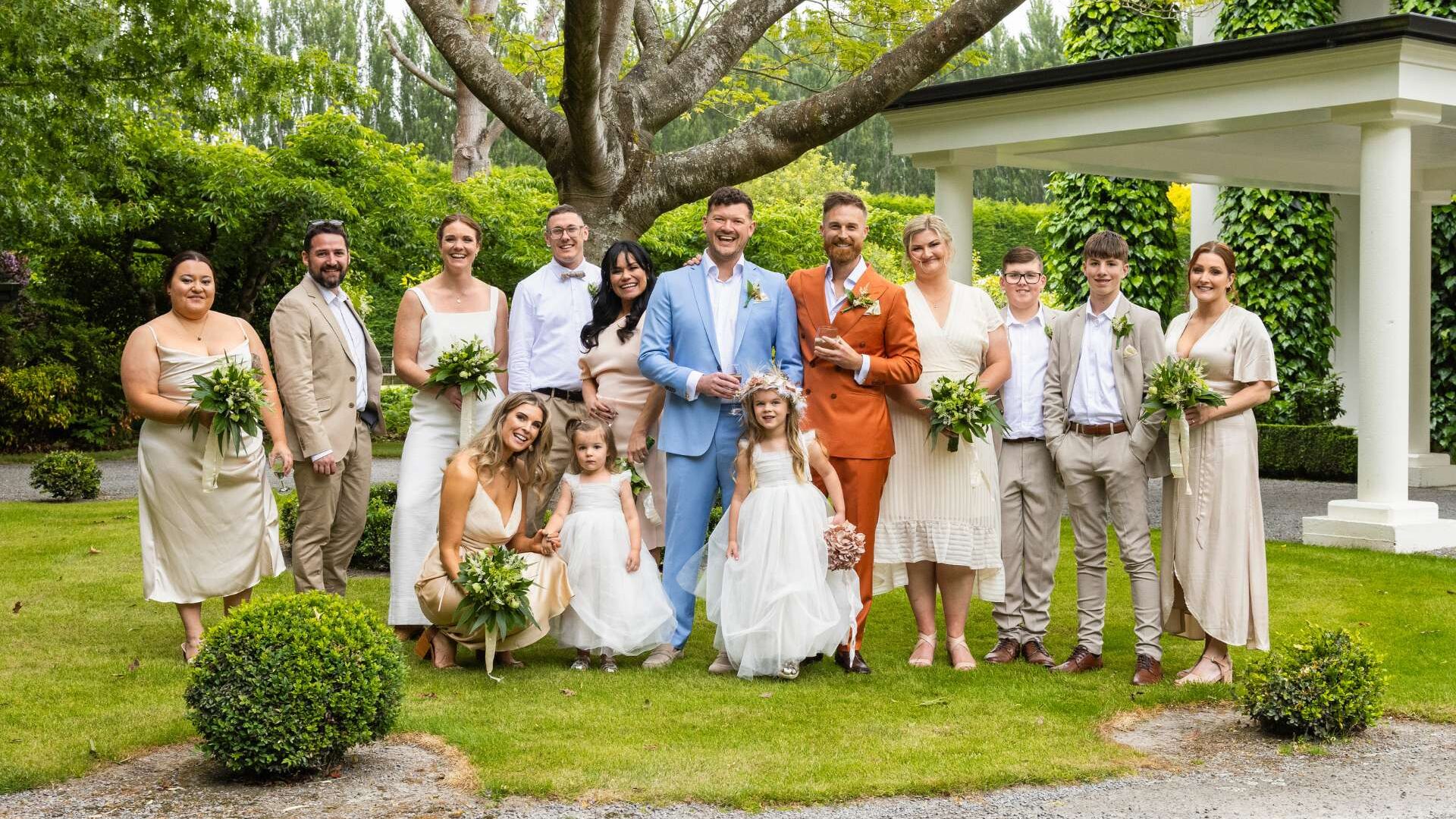 Jono Trenberth and Josh Martyn with their families on their wedding day