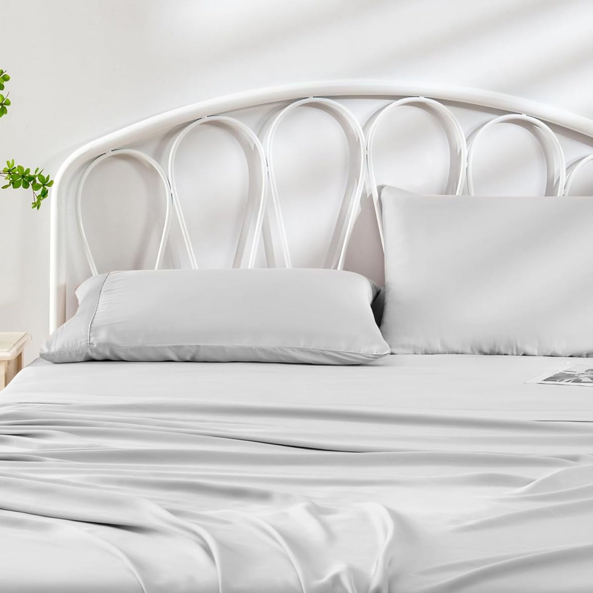 White bamboo sheet set on white bed