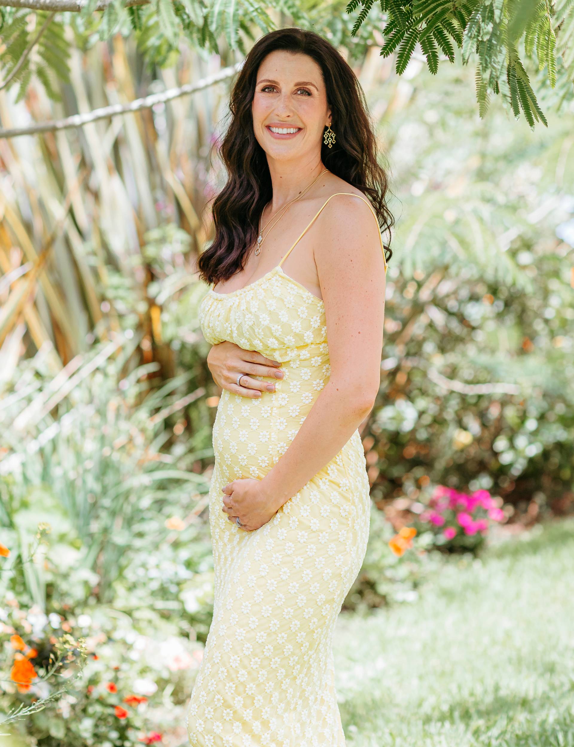 Nadine Higgins showing off her pregnant belly