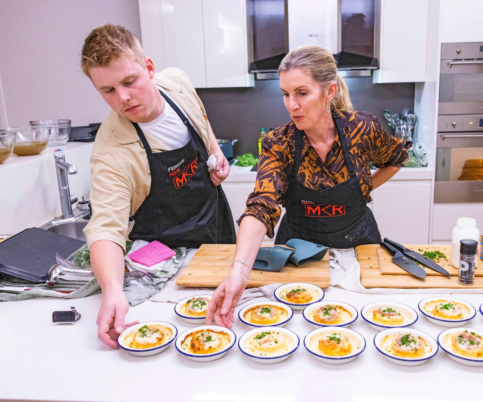 MKR finalists Caz and Fergus in the kitchen together