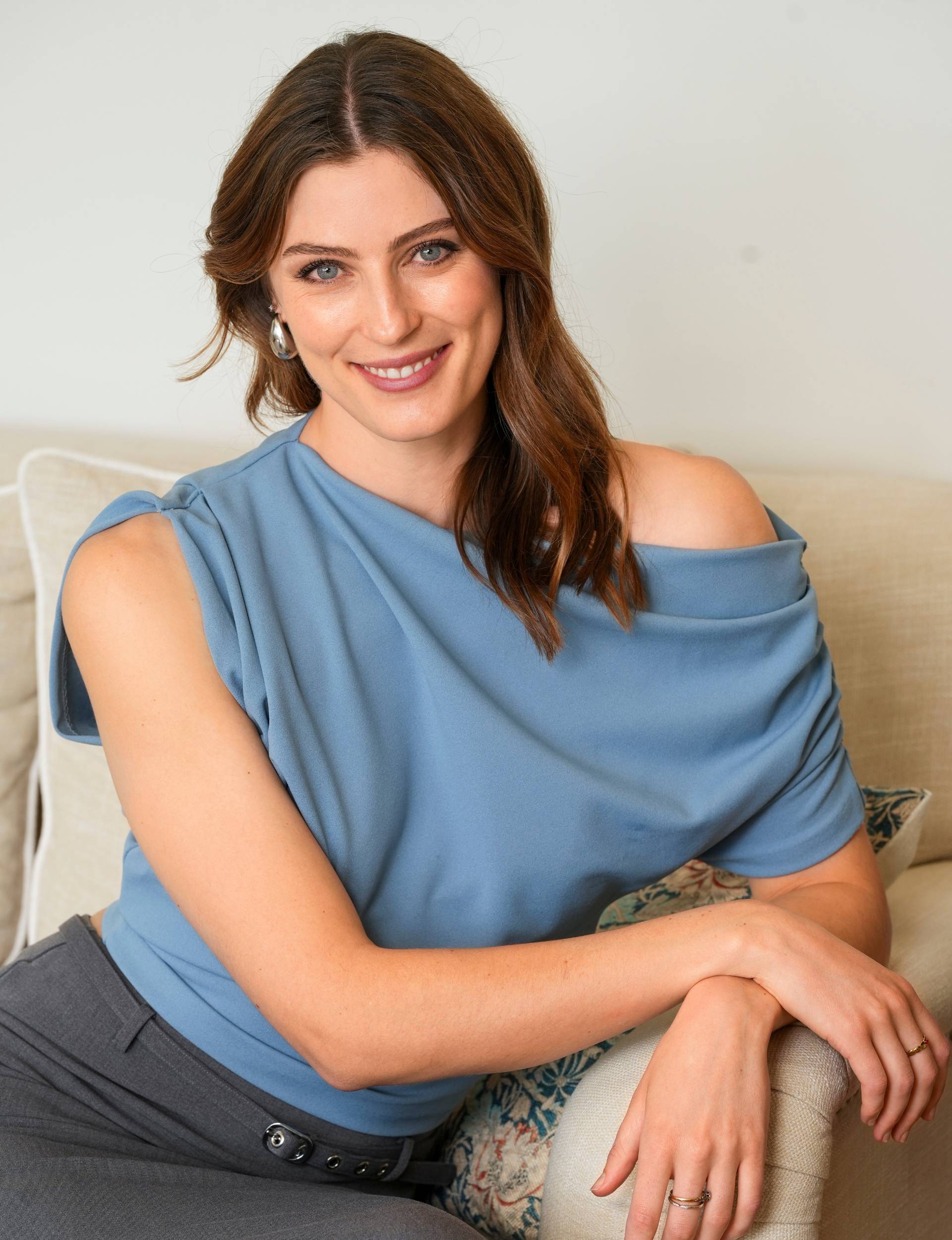 Jane Wills sitting on an armchair