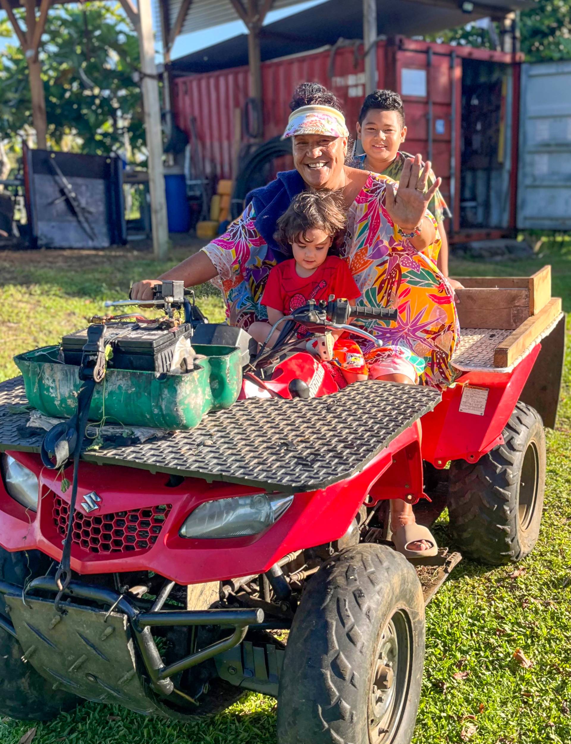 With her grandchildren on a quad bike