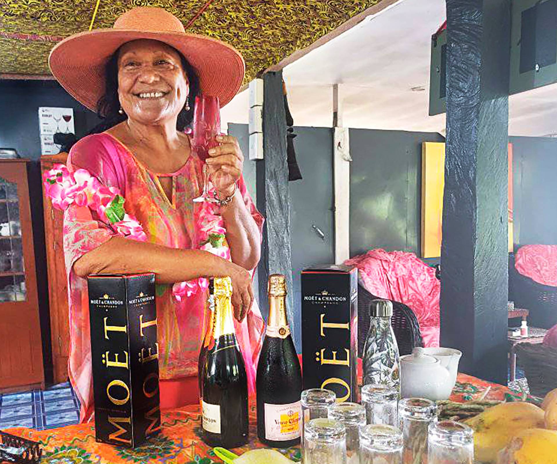 Ruth with two bottles of champagne