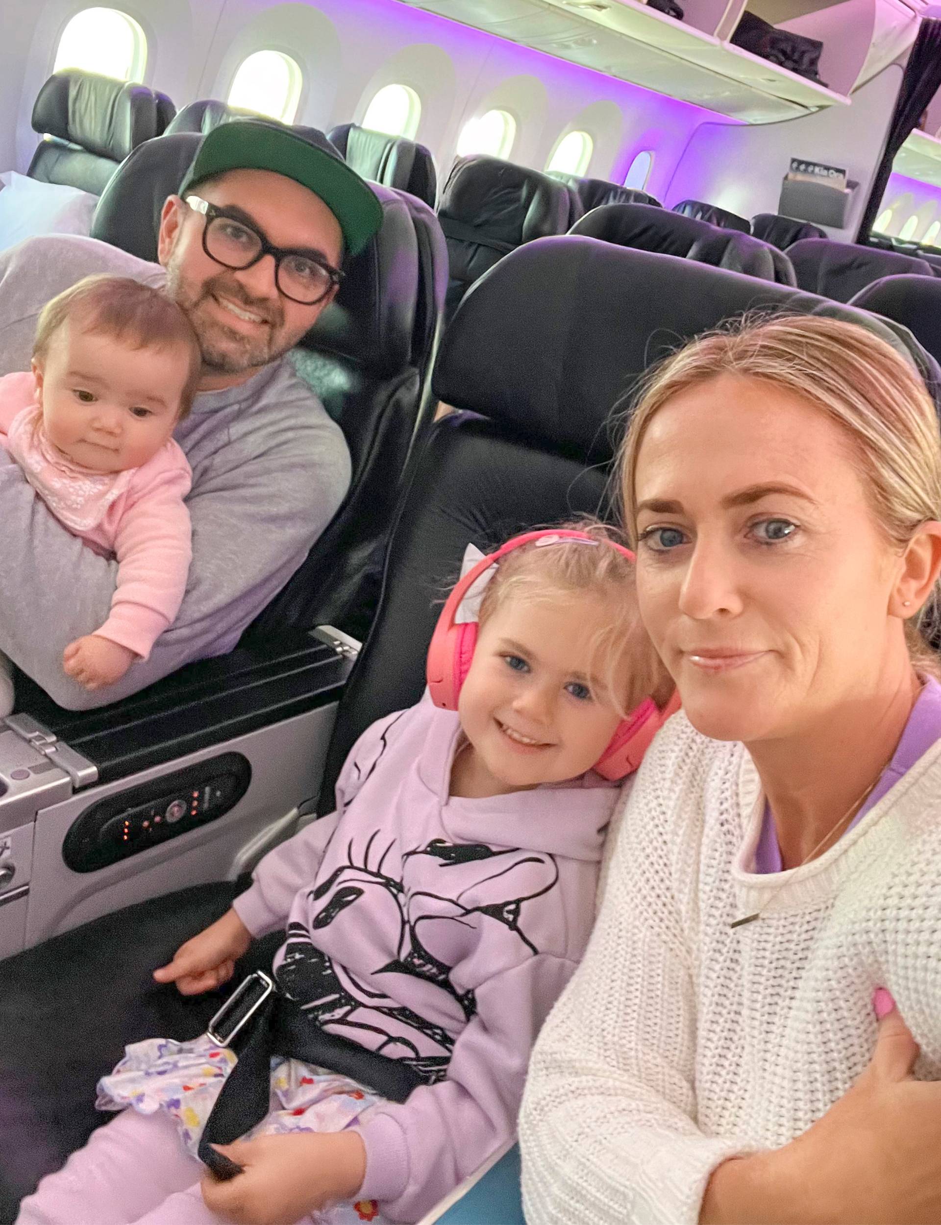 General Lee with his family on the plane on the way to their Fijian family holiday