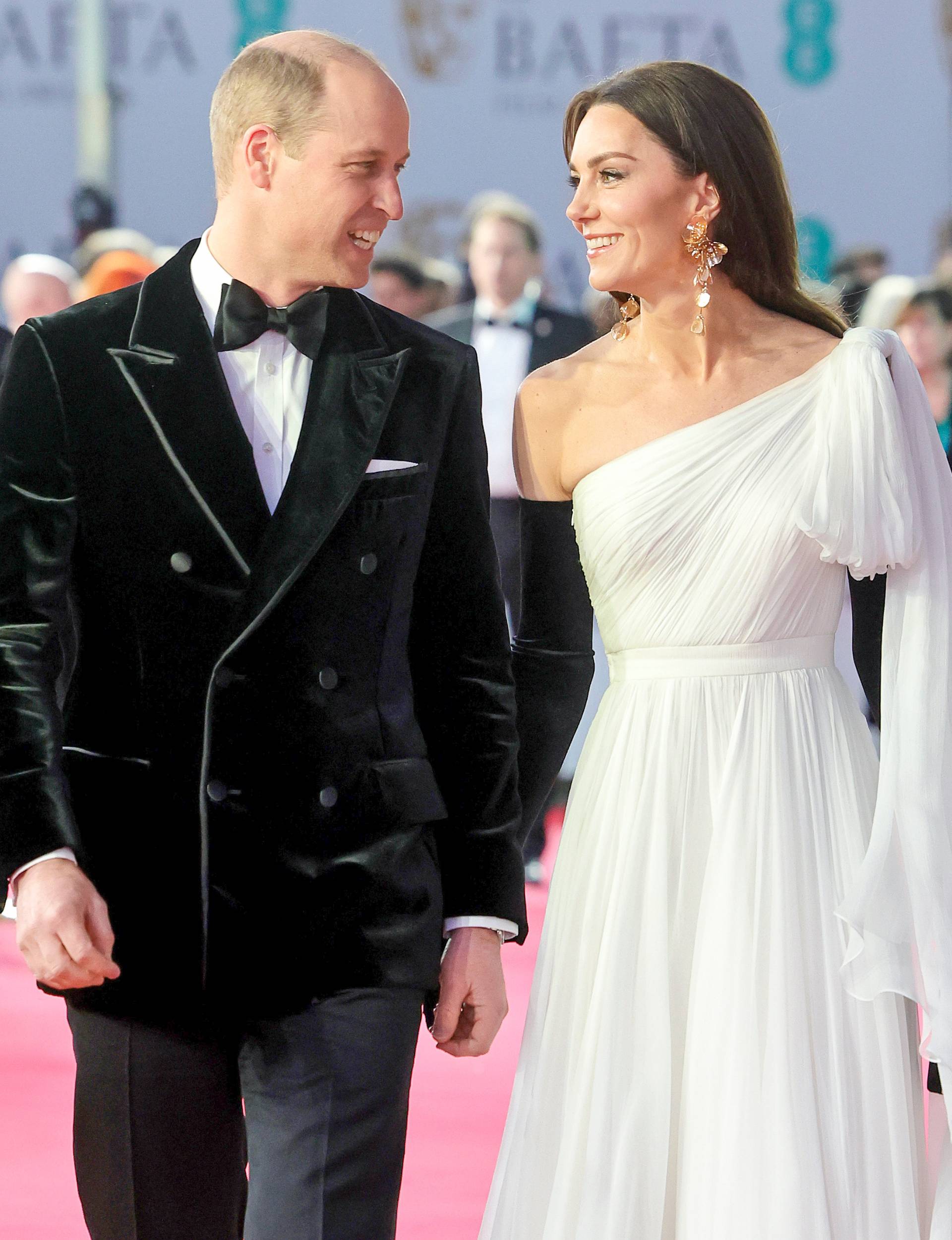 William and Kate smiling at each other in public