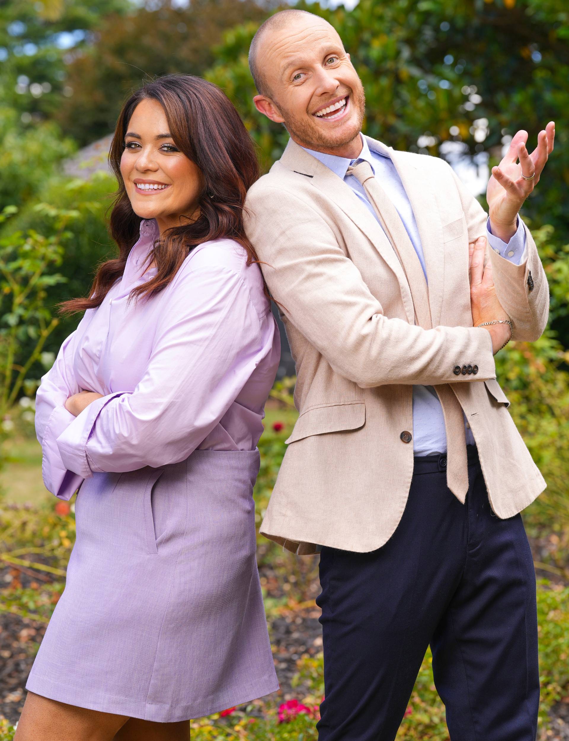 Jono Pryor and Laura Daniel laughing back to back