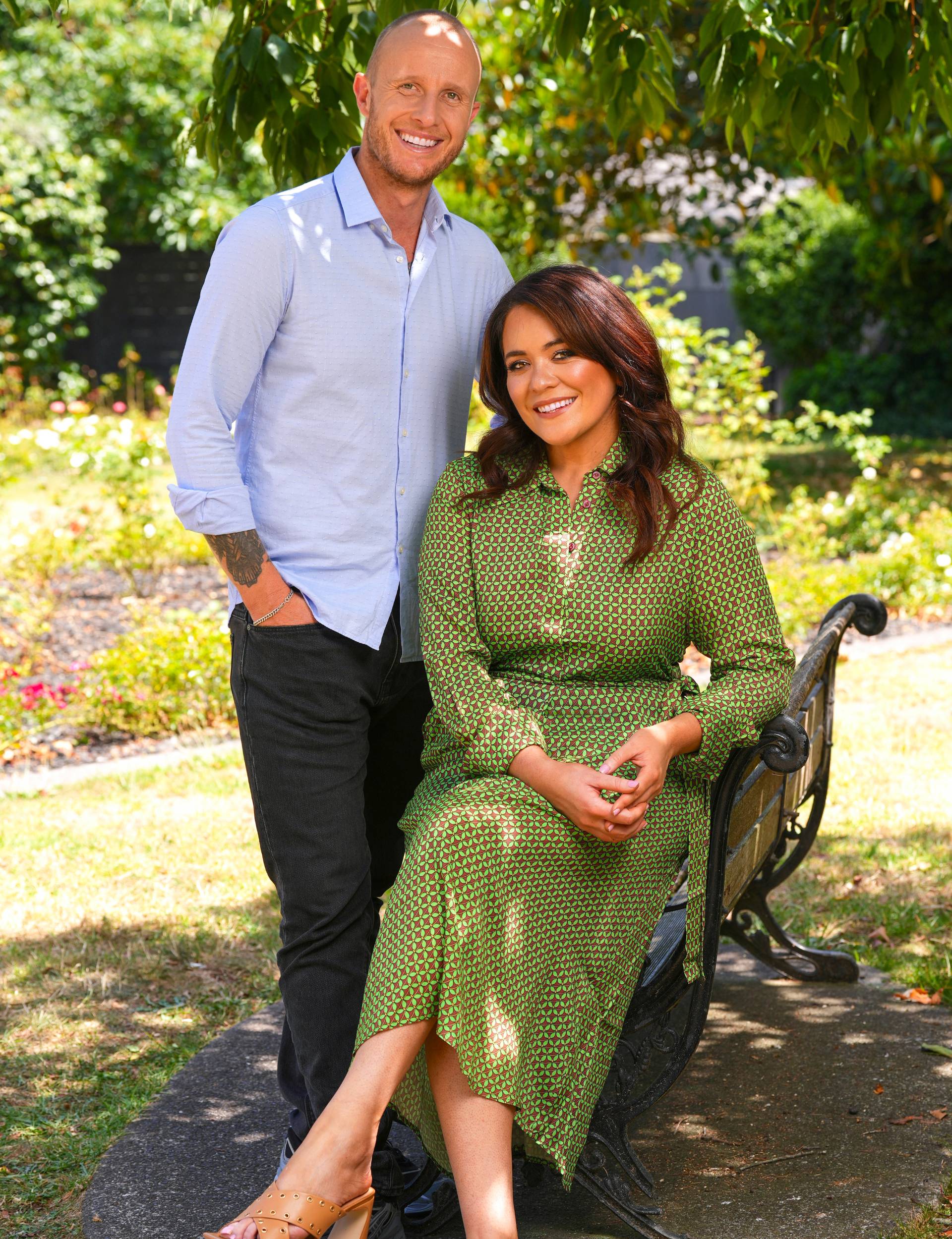 Jono Pryor and Laura Daniel smiling in a park