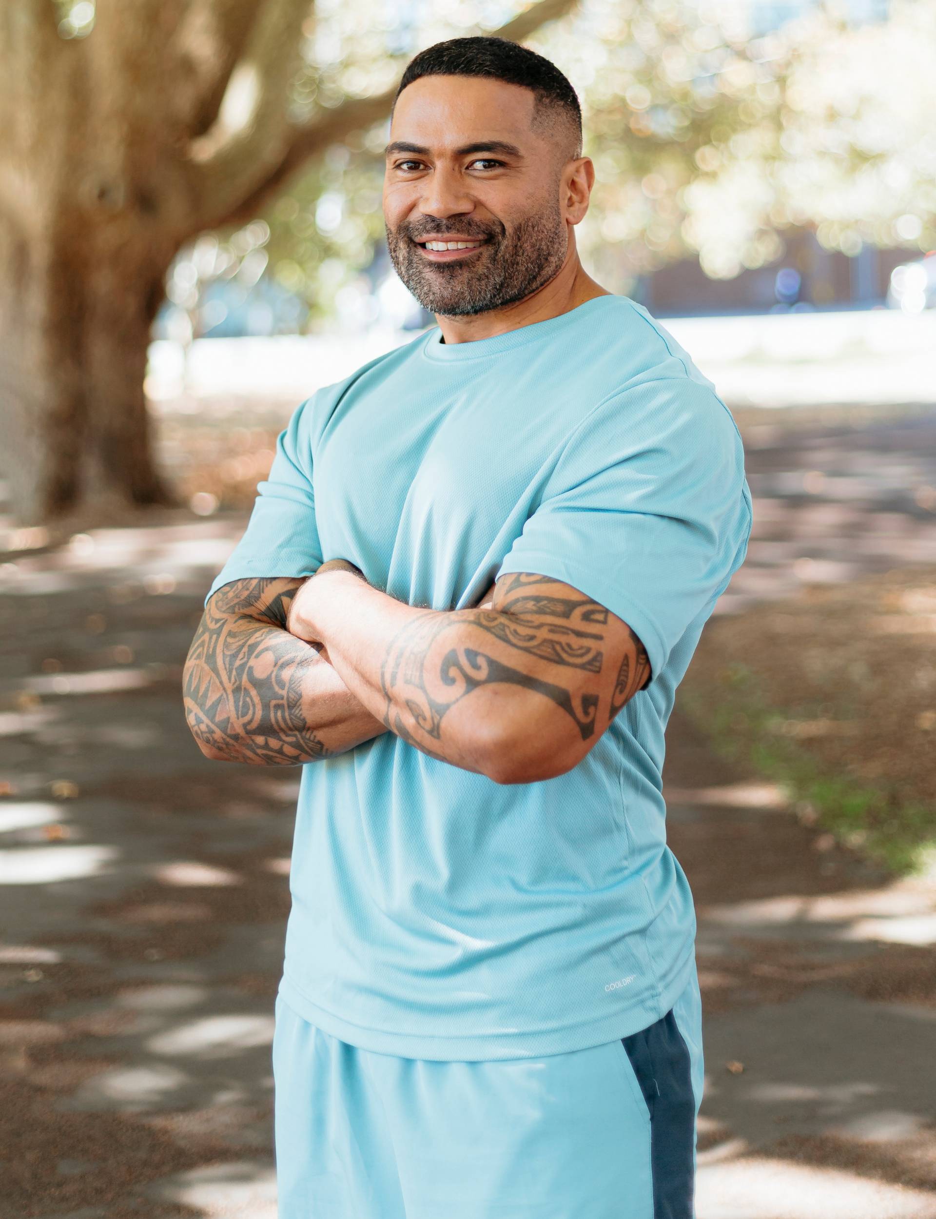 Charlie in bright blue fitness clothes