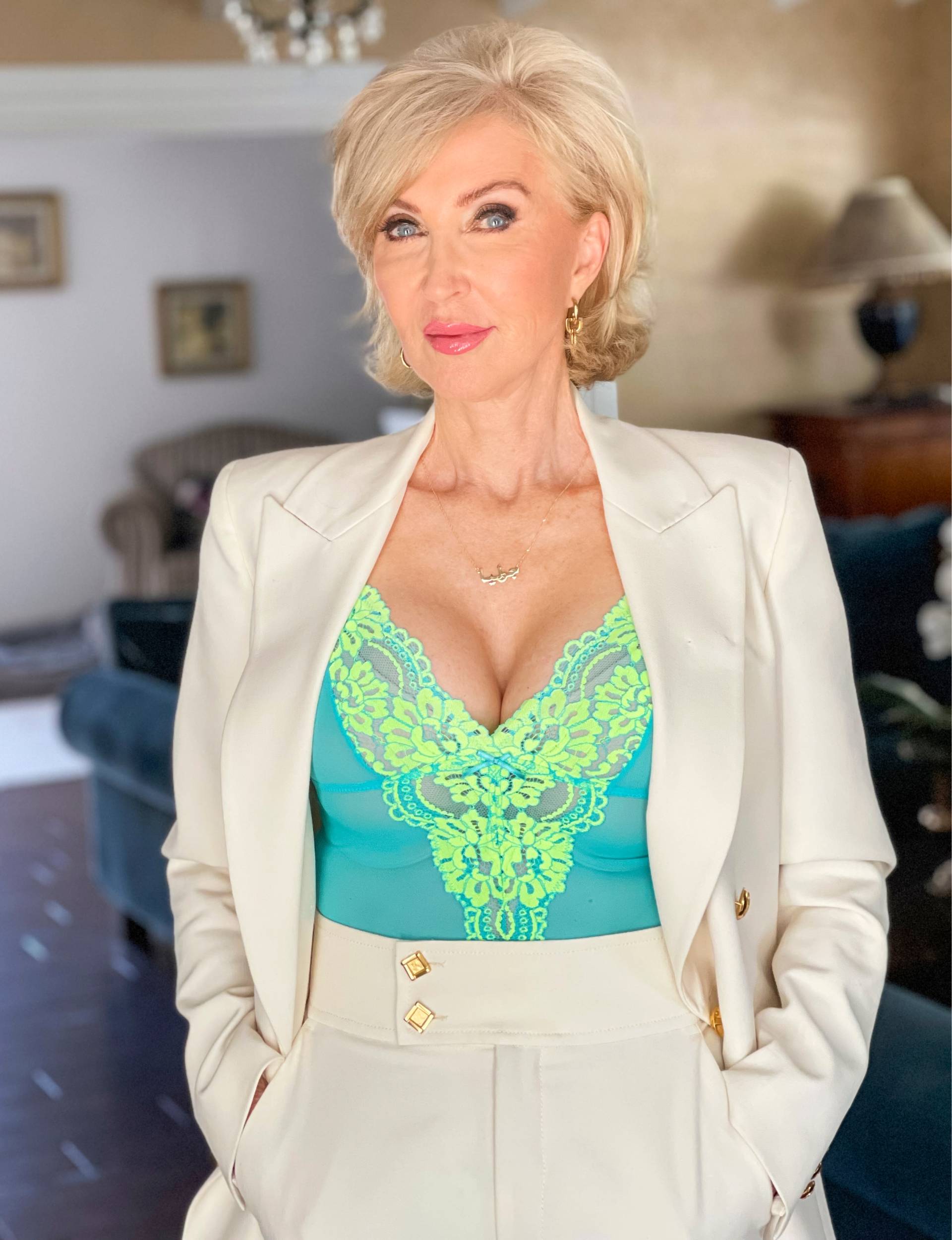 Julia Hartley Moore smiling in a beige suit