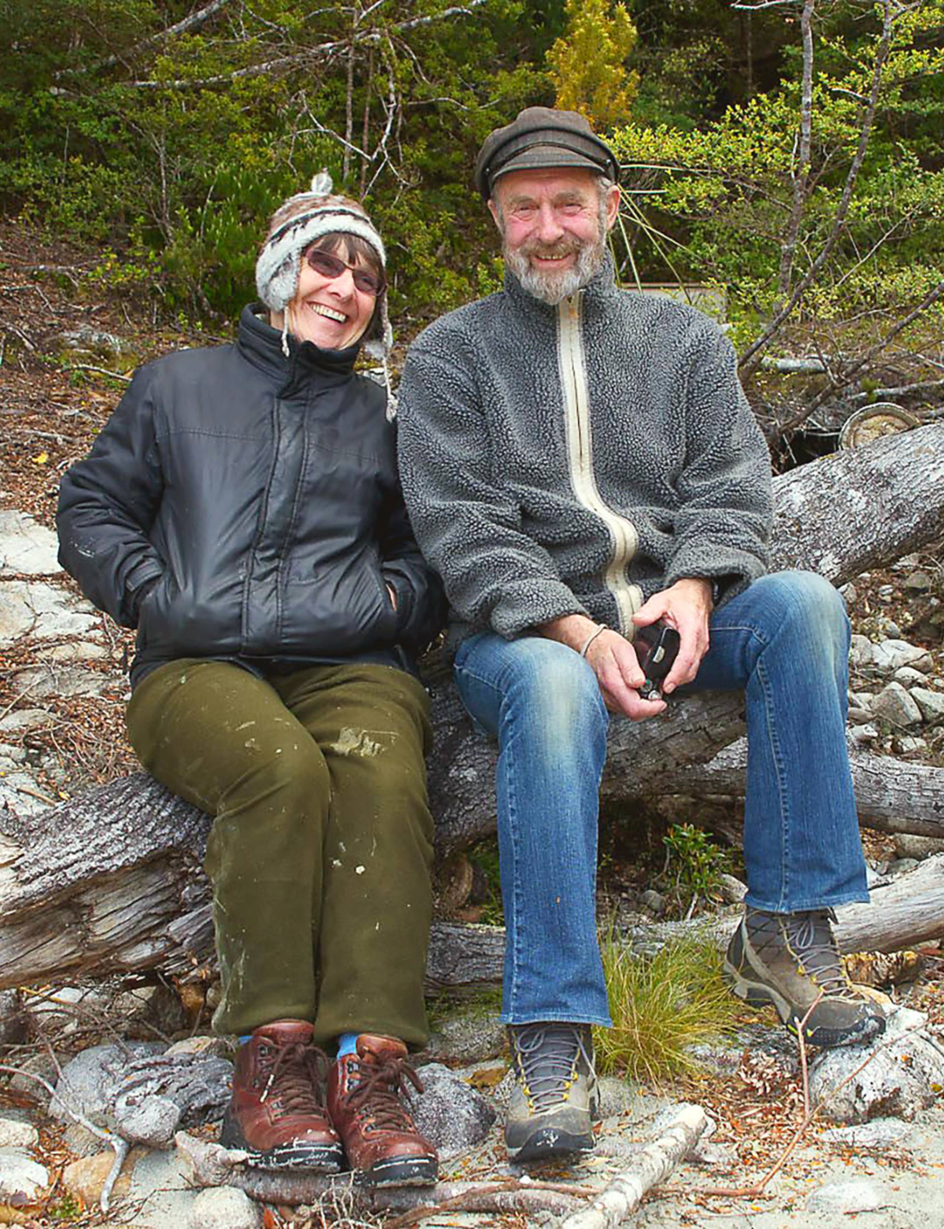 With her husband Lance sitting on a fallen log