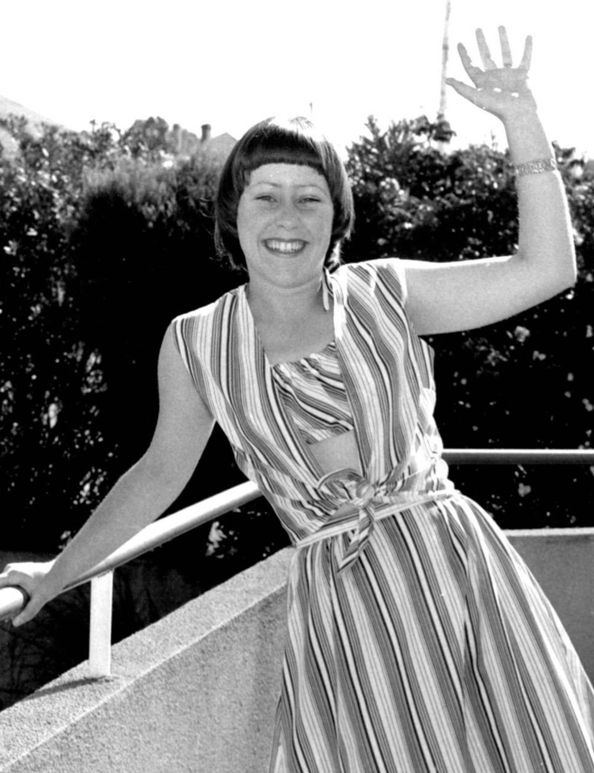 Suzanne Prentice waving from a balcony in 1977