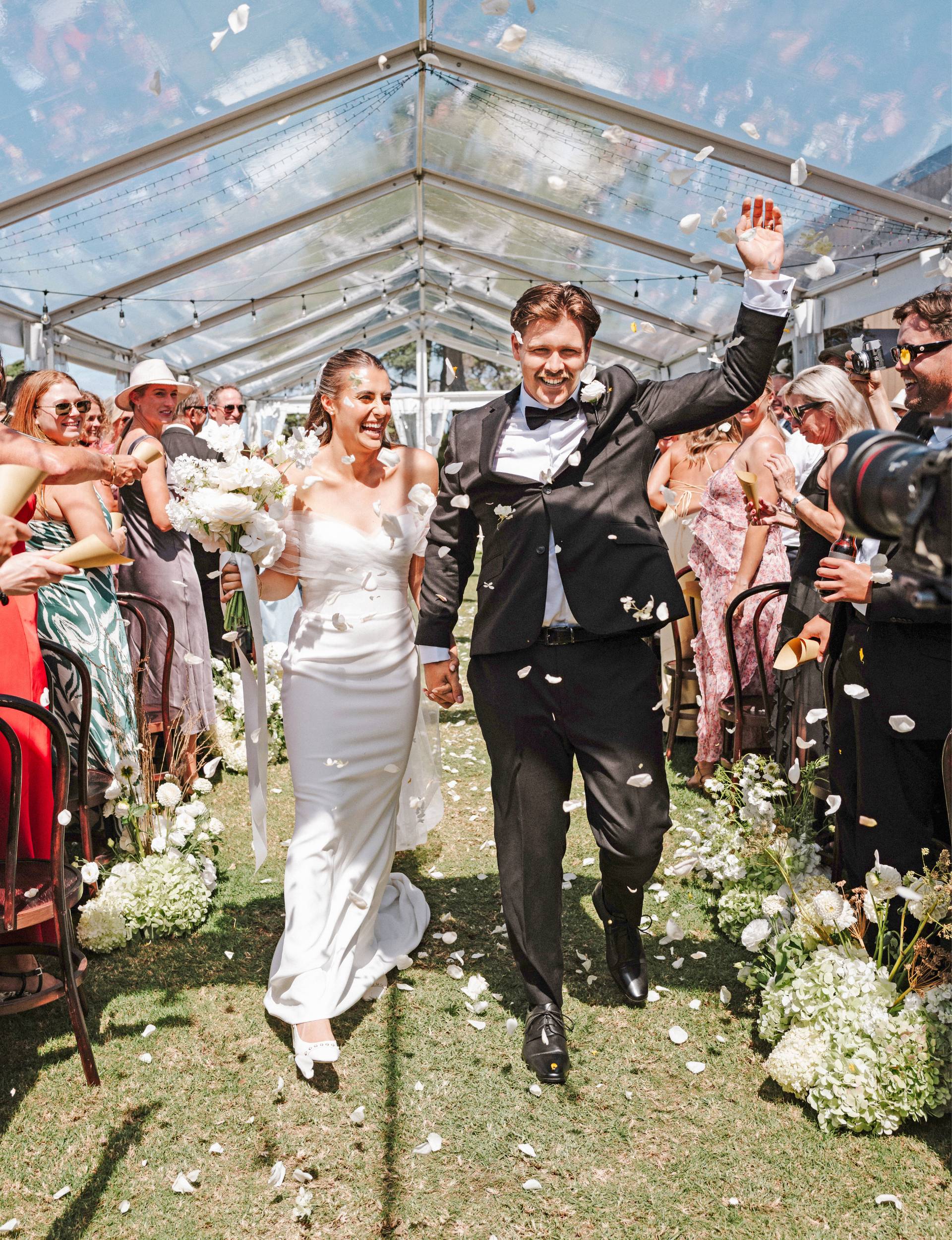 Kelsi and Andrew walking out of their wedding ceremony