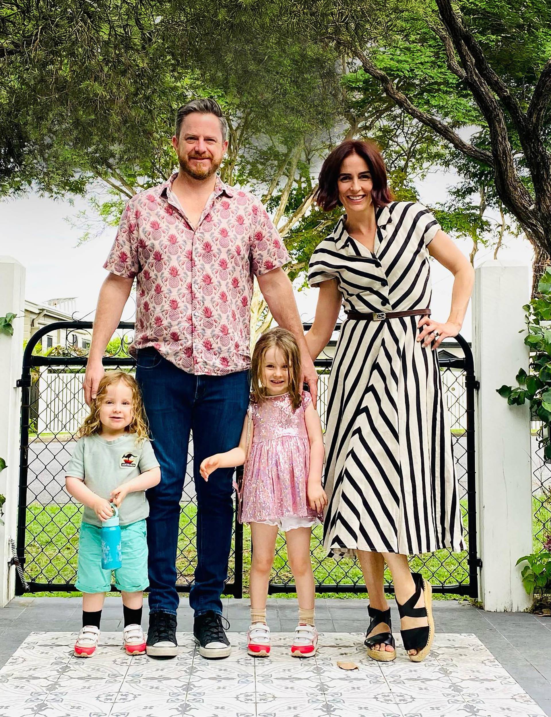 Alana in the garden with her husband and kids