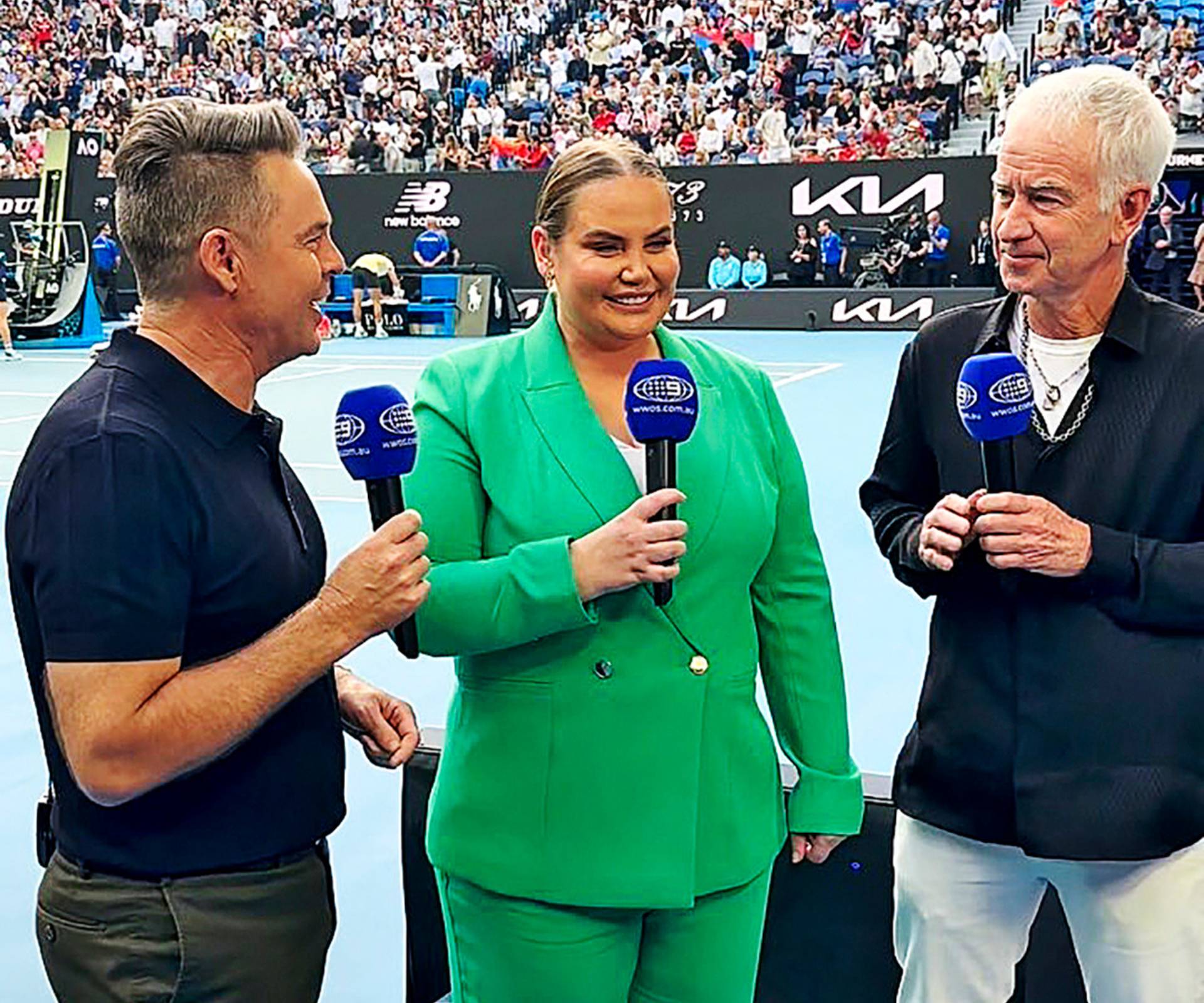 Jelena Dokic presenting for a news channel beside close friend Todd Woodridge