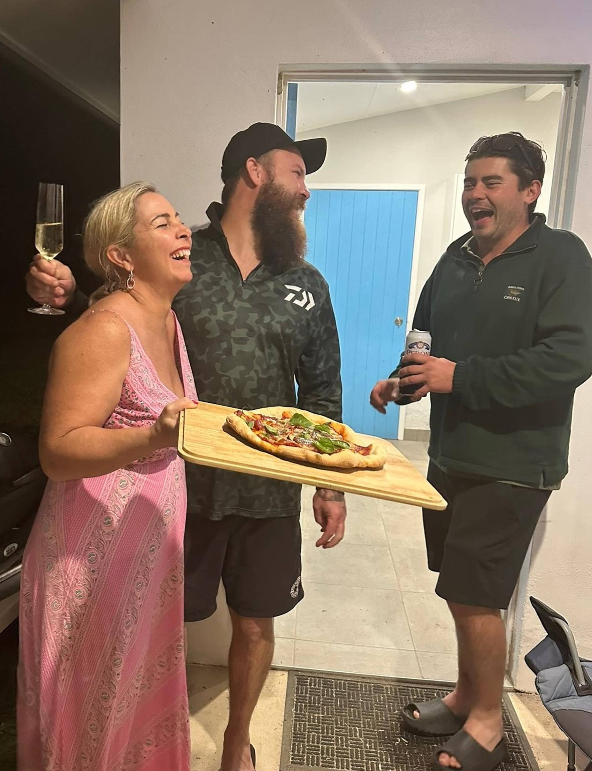 Declan and Rhiannon laughing in a home kitchen together