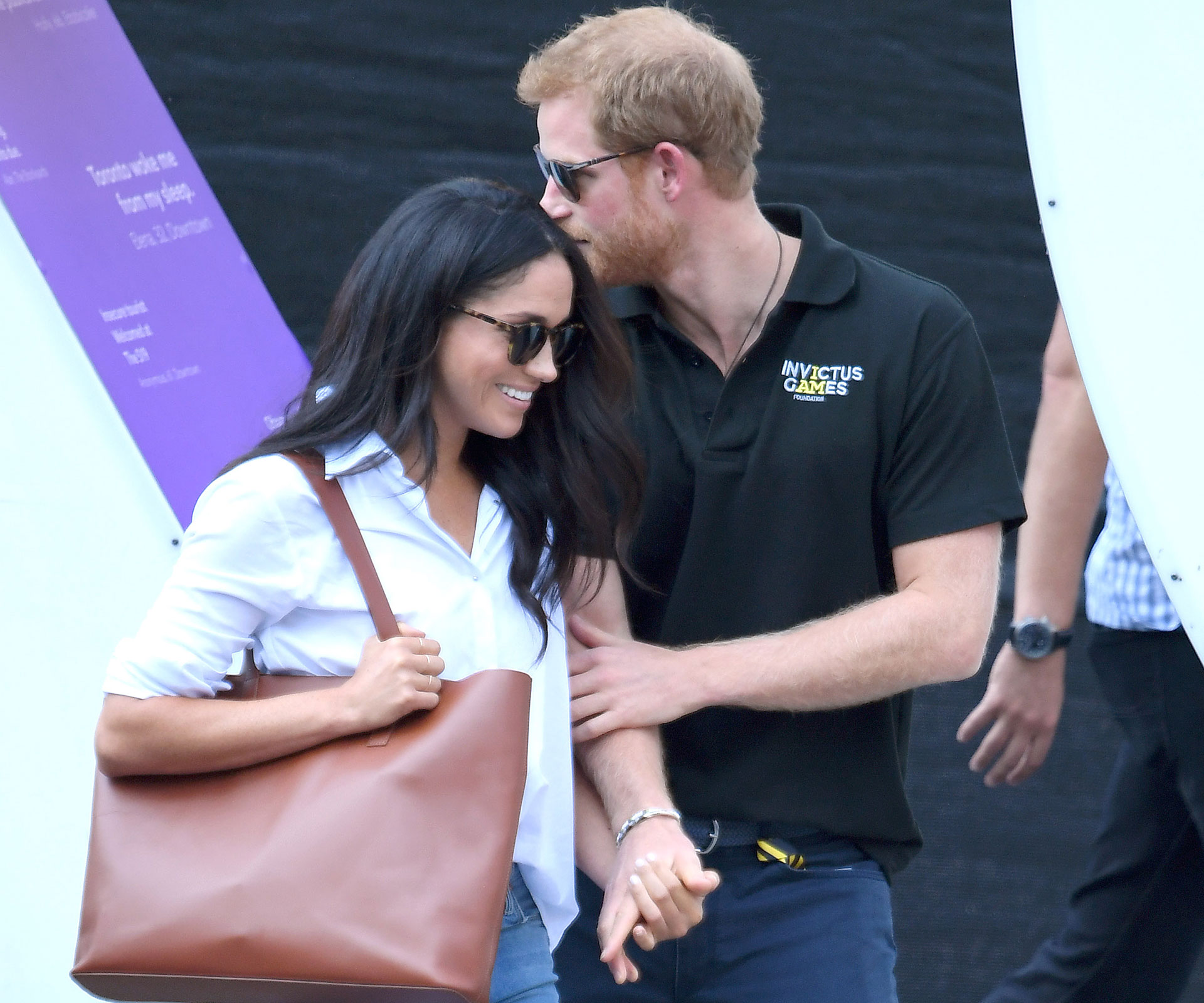 Love all! Prince Harry and Meghan Markle walk hand-in-hand at the Invictus Games