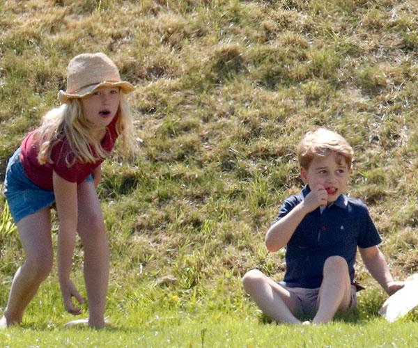 You can’t sit with us! Savannah Phillips pushes Prince George down a hill