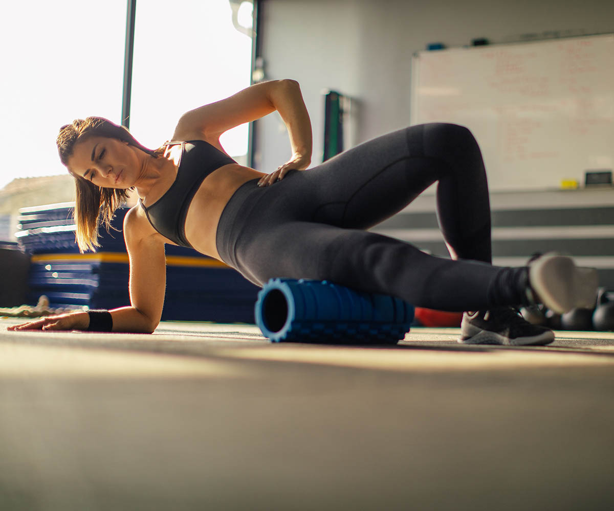 woman foam rolling exercise
