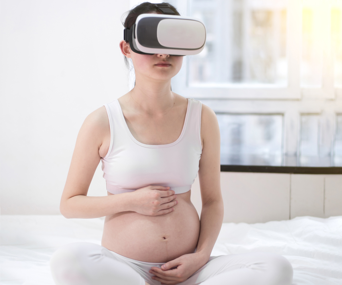 Pregnant woman using virtual reality headset
