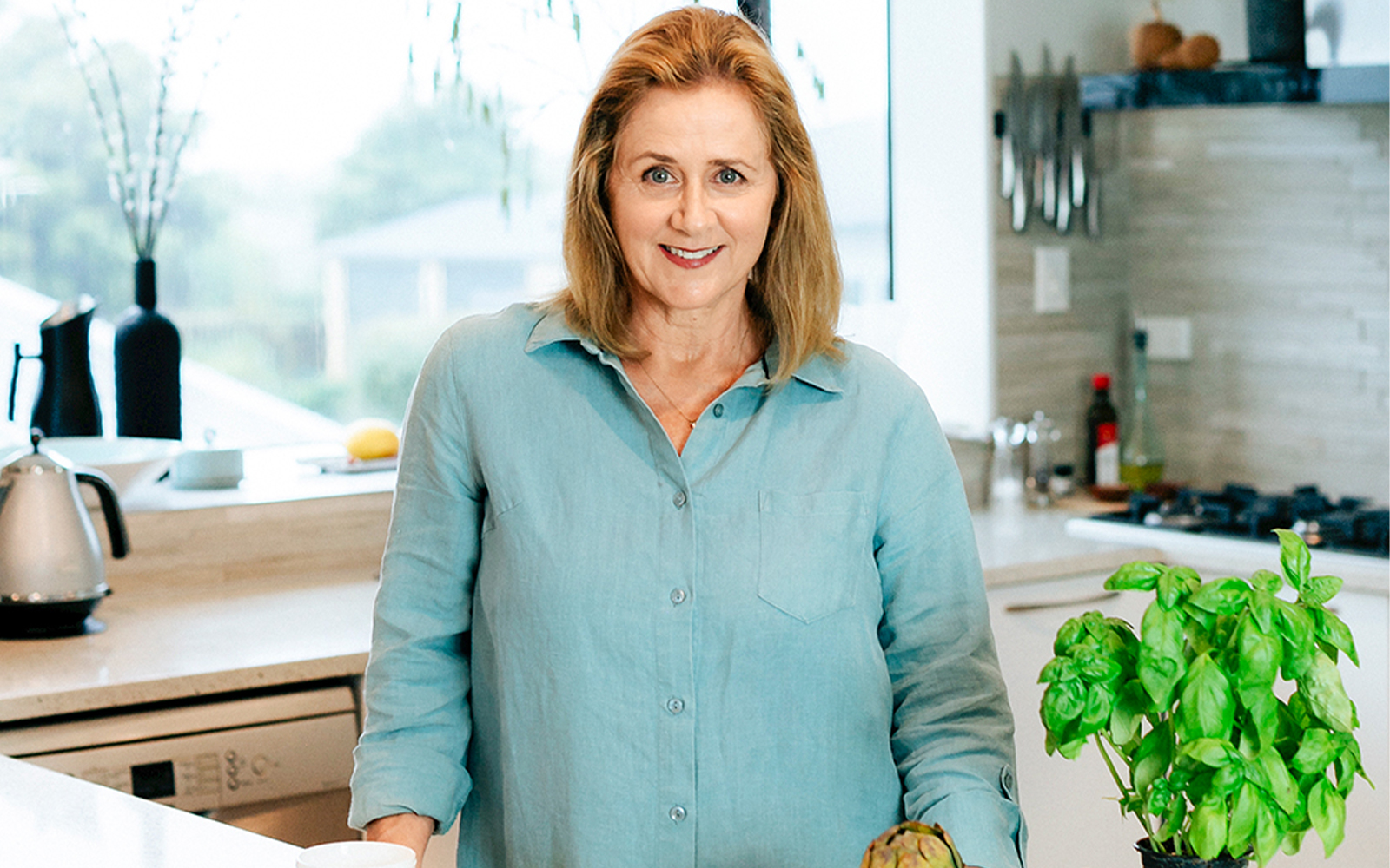 Deborah Manning putting food in hungry Kiwi tums