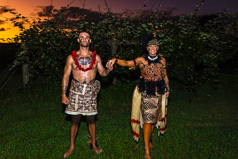 Niall and Tamāli'i in traditional outfits on their wedding day