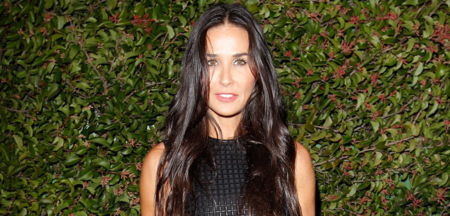 Russell Brand charms Demi Moore