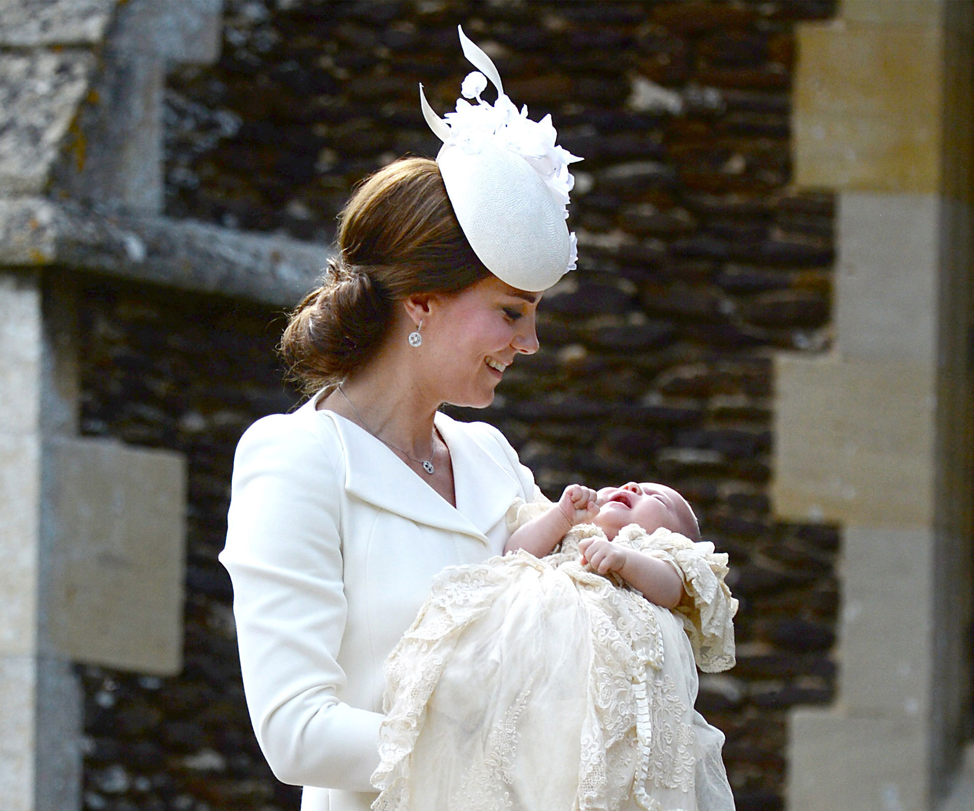 Catherine Duchess of Cambridge holding daughter Princess Charlotte on her christening day