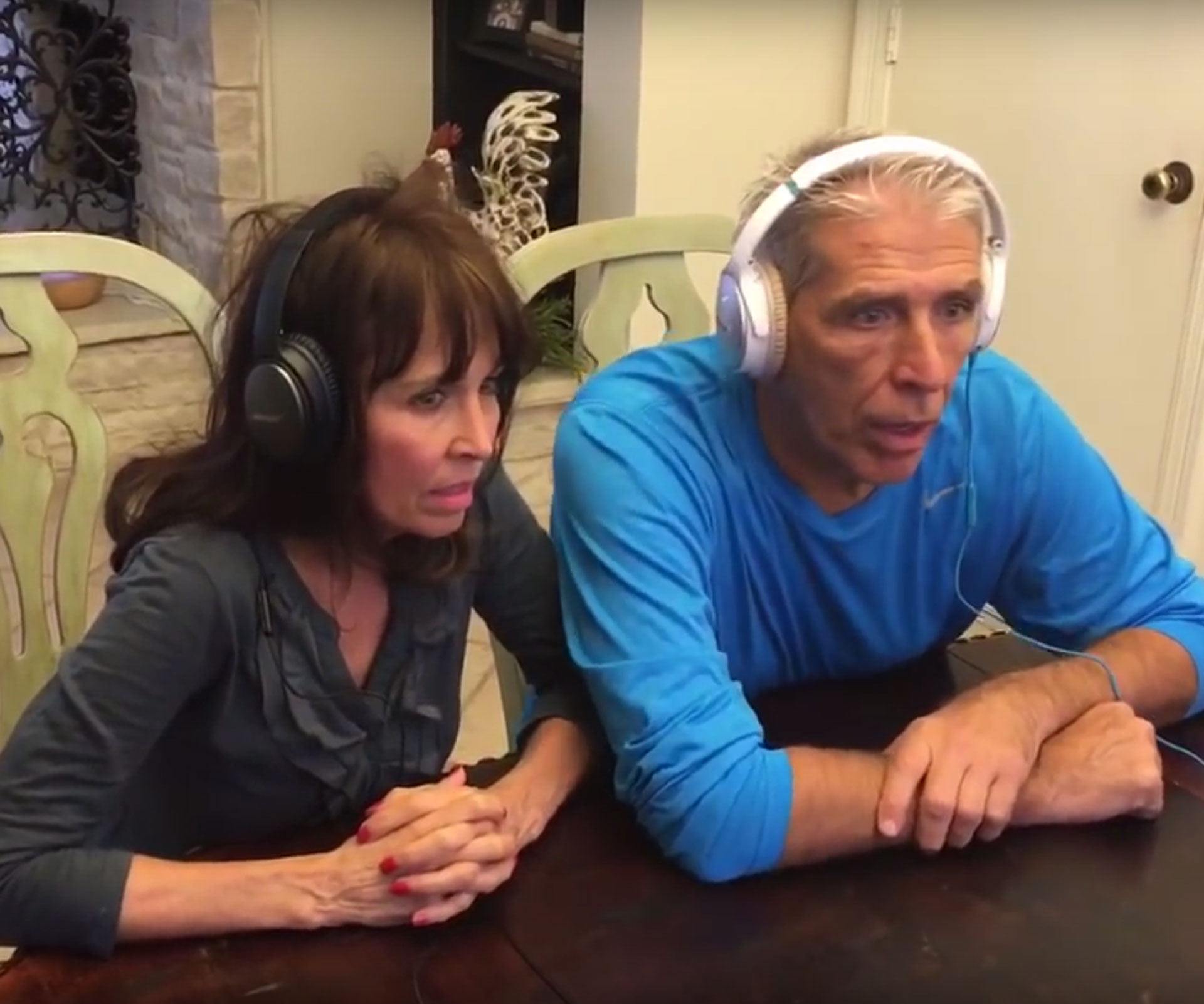 Couple wear noise cancelling headphones for daughter's pregnancy whisper challenge game.